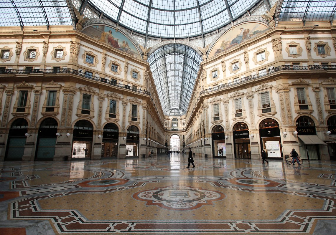 A city police officer walks in the Vittorio Emanuele II gallery shopping arcade in downtown Milan, Italy, Friday, Nov. 6, 2020. Lombardy is among the four Italian regions classified as red zones, where a strict lockdown was imposed starting Friday - to be reassessed in two weeks - in an effort to curb the COVID-19 infections growing curve. Starting today, only shops selling food and other essentials are allowed to open. (AP Photo/Antonio Calanni) A city police officer walks in the Vittorio Emanuele II gallery shopping arcade in downtown Milan, Italy, Friday, Nov. 6, 2020. Lombardy is among the four Italian regions classified as red zones, where a strict lockdown was imposed starting Friday - to be reassessed in two weeks - in an effort to curb the COVID-19 infections growing curve. Starting today, only shops selling food and other essentials are allowed to open. (AP Photo/Antonio Calanni)