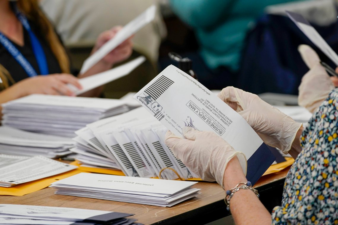 Municipal workers extract Luzerne County ballots from their envelopes, Wednesday, Nov. 4, 2020, in Wilkes-Barre, Pa. The fate of the United States presidency hung in the balance Wednesday morning, as President Donald Trump and Democratic challenger Joe Biden battled for three familiar battleground states, Wisconsin, Michigan and Pennsylvania, that could prove crucial in determining who wins the White House. (AP Photo/Mary Altaffer) Municipal workers extract Luzerne County ballots from their envelopes, Wednesday, Nov. 4, 2020, in Wilkes-Barre, Pa. The fate of the United States presidency hung in the balance Wednesday morning, as President Donald Trump and Democratic challenger Joe Biden battled for three familiar battleground states, Wisconsin, Michigan and Pennsylvania, that could prove crucial in determining who wins the White House. (AP Photo/Mary Altaffer)