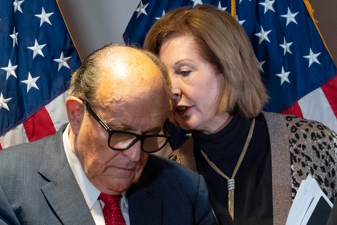 Former Mayor of New York Rudy Giuliani, left, listens to Sidney Powell, both lawyers for President Donald Trump, during a news conference at the Republican National Committee headquarters, Thursday Nov. 19, 2020, in Washington. (AP Photo/Jacquelyn Martin) Former Mayor of New York Rudy Giuliani, left, listens to Sidney Powell, both lawyers for President Donald Trump, during a news conference at the Republican National Committee headquarters, Thursday Nov. 19, 2020, in Washington. (AP Photo/Jacquelyn Martin)