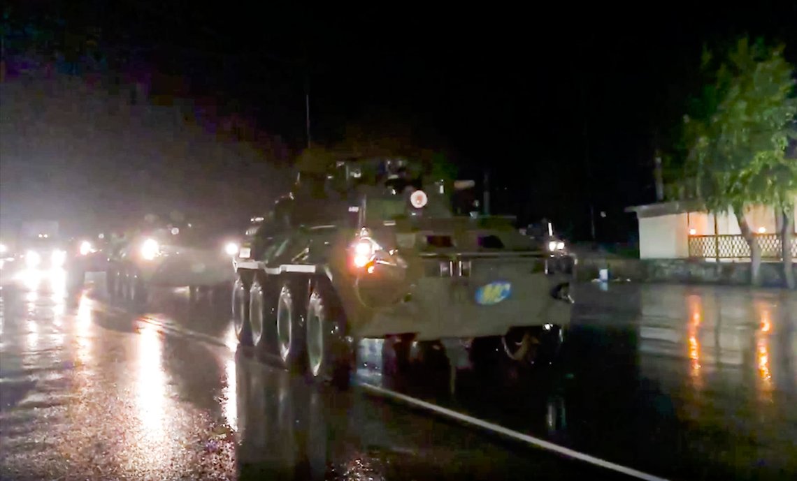 This photo made from the footage provided by Russian Defense Ministry press service on Thursday, Nov. 12, 2020, shows Russian military vehicles enter Stepanakert, the separatist region of Nagorno-Karabakh. Dozens of Russian peacekeepers destined for Nagorno-Karabakh have begun deploying hours after Armenia and Azerbaijan agreed to halt fighting over the separatist region. (Russian Defense Ministry Press Service via AP) This photo made from the footage provided by Russian Defense Ministry press service on Thursday, Nov. 12, 2020, shows Russian military vehicles enter Stepanakert, the separatist region of Nagorno-Karabakh. Dozens of Russian peacekeepers destined for Nagorno-Karabakh have begun deploying hours after Armenia and Azerbaijan agreed to halt fighting over the separatist region. (Russian Defense Ministry Press Service via AP)