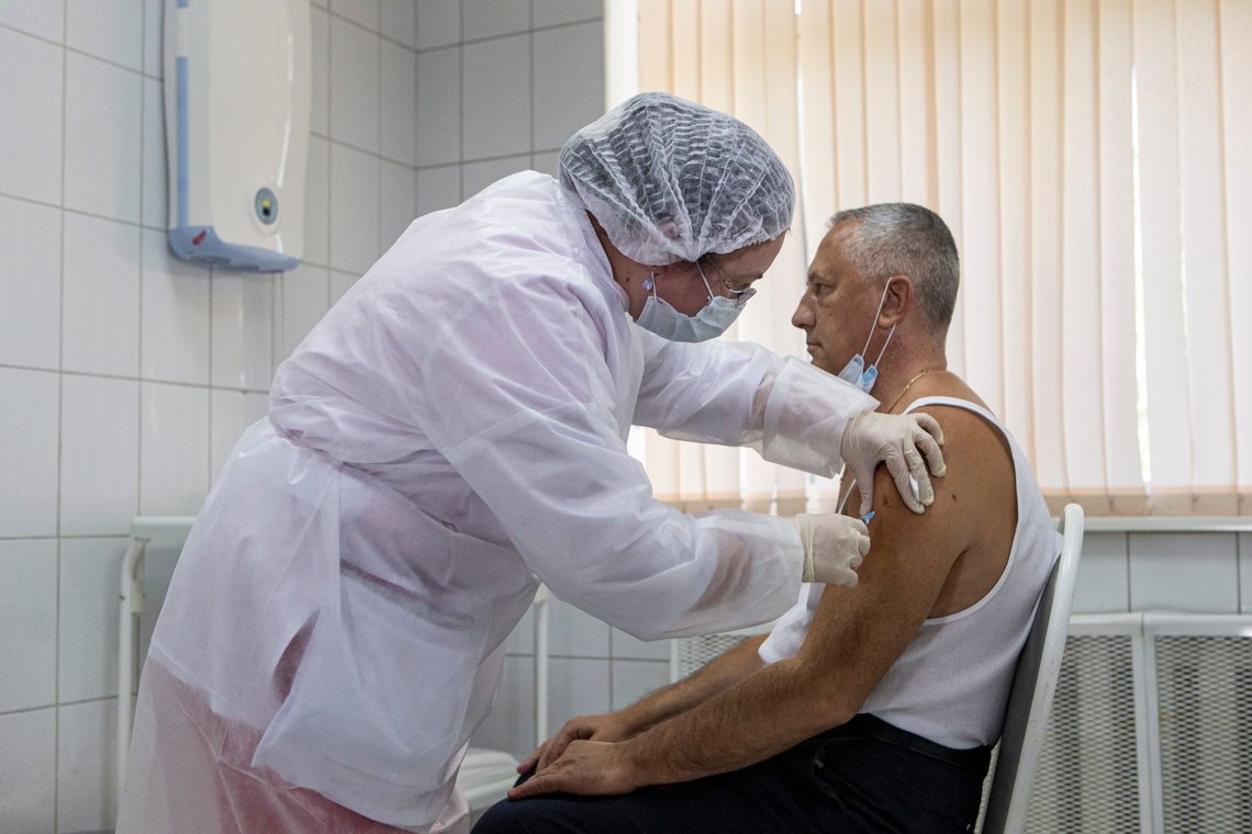 FILE - In this Sept. 15, 2020, file photo, a Russian medical worker administers a shot of Russia's experimental Sputnik V coronavirus vaccine in Moscow, Russia. Developers of Sputnik V, Russia's COVID-19 vaccine, announced Wednesday that the jab appeared to be 92% effective in advanced trials, in a statement that comes just two days after a similar one from Pfizer Inc. and indicates Moscow's eagerness to get ahead in the worldwide race for a successful coronavirus vaccine. (AP Photo/Alexander Zemlianichenko Jr, File) FILE - In this Sept. 15, 2020, file photo, a Russian medical worker administers a shot of Russia's experimental Sputnik V coronavirus vaccine in Moscow, Russia. Developers of Sputnik V, Russia's COVID-19 vaccine, announced Wednesday that the jab appeared to be 92% effective in advanced trials, in a statement that comes just two days after a similar one from Pfizer Inc. and indicates Moscow's eagerness to get ahead in the worldwide race for a successful coronavirus vaccine. (AP Photo/Alexander Zemlianichenko Jr, File)