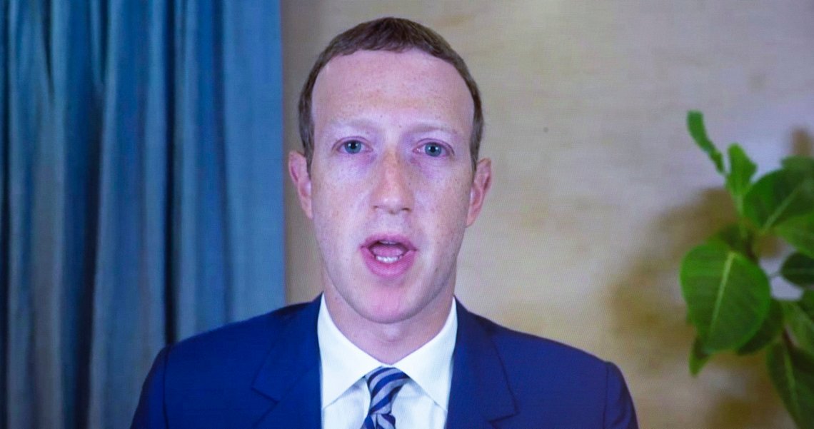 FILE - In this Oct. 28. 2020 file photo, Facebook CEO of Mark Zuckerberg appears on a screen as he speaks remotely during a hearing before the Senate Commerce Committee on Capitol Hill in Washington. (Michael Reynolds/Pool via AP) FILE - In this Oct. 28. 2020 file photo, Facebook CEO of Mark Zuckerberg appears on a screen as he speaks remotely during a hearing before the Senate Commerce Committee on Capitol Hill in Washington. (Michael Reynolds/Pool via AP)