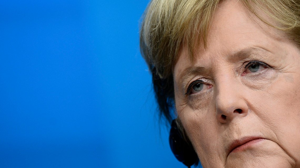 German Chancellor Angela Merkel listens to questions during a media conference at an EU summit in Brussels, Friday, Dec. 11, 2020. European Union leaders have reached a hard-fought deal to cut the bloc's greenhouse gas emissions by at least 55 percent by the end of the decade compared with 1990 levels, avoiding a hugely embarrassing deadlock ahead of a U.N. climate meeting this weekend. (Johanna Geron, Pool via AP) German Chancellor Angela Merkel listens to questions during a media conference at an EU summit in Brussels, Friday, Dec. 11, 2020. European Union leaders have reached a hard-fought deal to cut the bloc's greenhouse gas emissions by at least 55 percent by the end of the decade compared with 1990 levels, avoiding a hugely embarrassing deadlock ahead of a U.N. climate meeting this weekend. (Johanna Geron, Pool via AP)