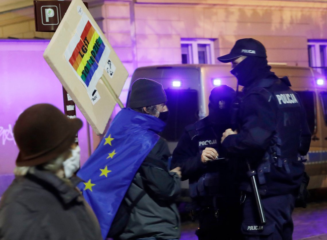 FILE - In this Nov. 5, 2020 file photo, protesters carry an EU flag at an anti-government protest in Warsaw, Poland. Some Poles are afraid that a drawn-out conflict with the EU over the next budget and values could put them on a path toward an eventual departure from the bloc, or "Polexit." Poland's conservative government denies that it has ever wanted to leave the 27-member bloc and popular support for EU membership runs very high. But critics fear the combative tone of some Polish leaders could create momentum which could accidently bring the nation to the exit door.(AP Photo/Czarek Sokolowski, File) FILE - In this Nov. 5, 2020 file photo, protesters carry an EU flag at an anti-government protest in Warsaw, Poland. Some Poles are afraid that a drawn-out conflict with the EU over the next budget and values could put them on a path toward an eventual departure from the bloc, or "Polexit." Poland's conservative government denies that it has ever wanted to leave the 27-member bloc and popular support for EU membership runs very high. But critics fear the combative tone of some Polish leaders could create momentum which could accidently bring the nation to the exit door.(AP Photo/Czarek Sokolowski, File)