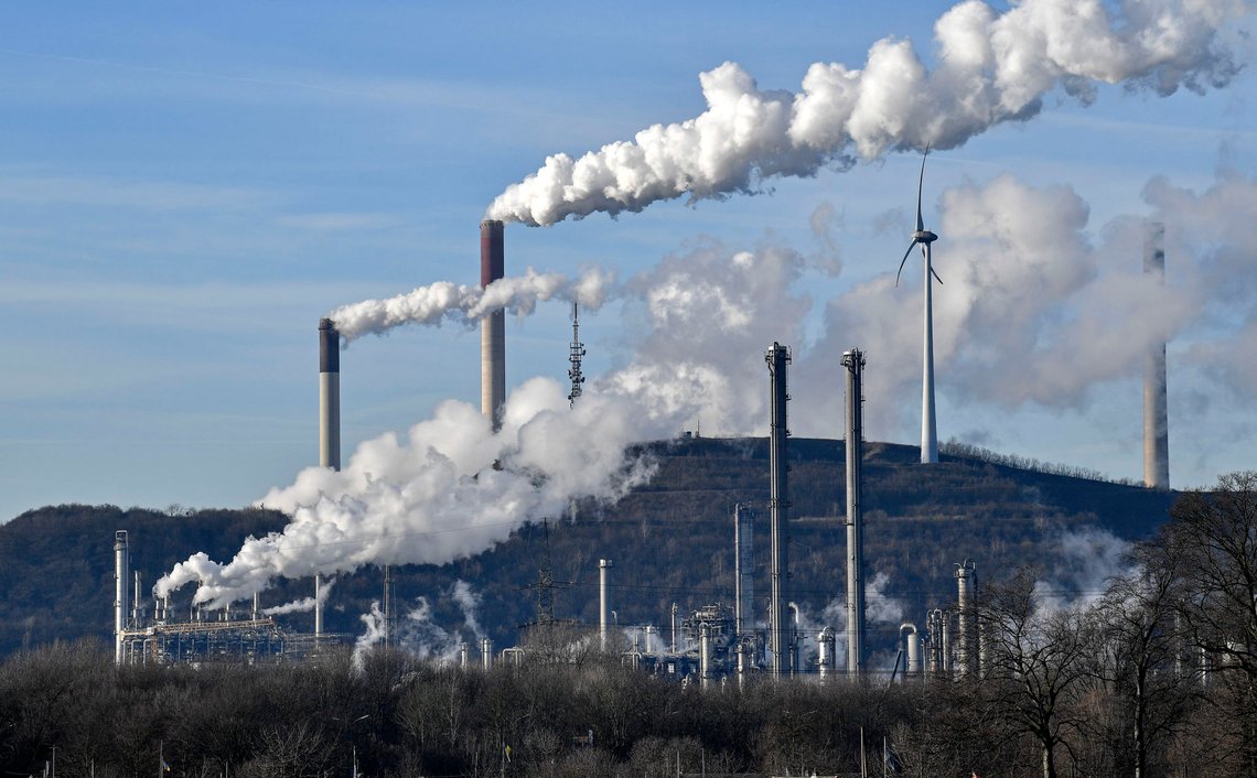 FILE-In this Jan. 16, 2020 file photo an uniper coal-fired power plant and BP refinery steam beside a wind generator in Gelsenkirchen, Germany. The state governors Dietmar Woidke of Brandenburg, Michael Kretschmer of Saxony, Reiner Haseloff of Saxony-Anhalt and Armin Laschet of North Rhine-Westphalia meet in Berlin for the adoption by the Bundestag and Bundesrat of the laws on coal phase-out and structural strengthening in the affected federal states. (AP Photo/Martin Meissner) FILE-In this Jan. 16, 2020 file photo an uniper coal-fired power plant and BP refinery steam beside a wind generator in Gelsenkirchen, Germany. The state governors Dietmar Woidke of Brandenburg, Michael Kretschmer of Saxony, Reiner Haseloff of Saxony-Anhalt and Armin Laschet of North Rhine-Westphalia meet in Berlin for the adoption by the Bundestag and Bundesrat of the laws on coal phase-out and structural strengthening in the affected federal states. (AP Photo/Martin Meissner)
