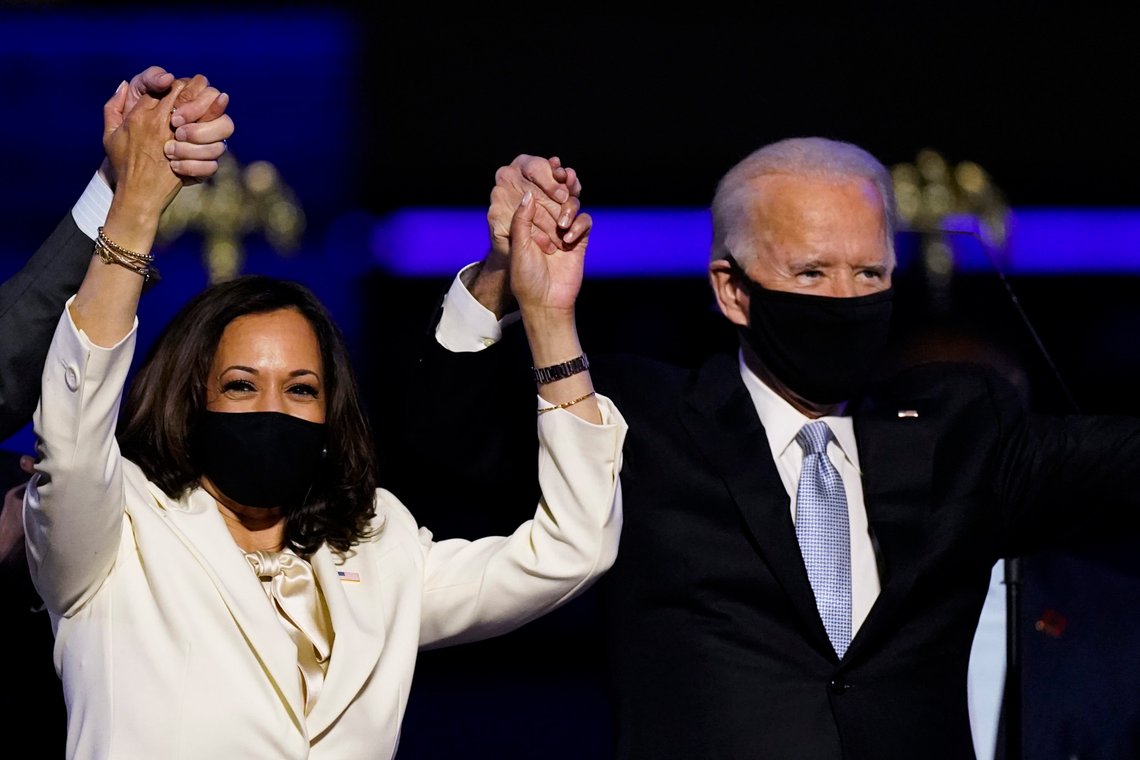 FILE - In this Nov. 7, 2020, file photo Vice President-elect Kamala Harris holds hands with President-elect Joe Biden and her husband Doug Emhoff as they celebrate in Wilmington, Del. Black policy leaders will play a pivotal role in President-elect Joe Bidens transition team, marking one of the most diverse presidential agency review teams in history. (AP Photo/Andrew Harnik, File) FILE - In this Nov. 7, 2020, file photo Vice President-elect Kamala Harris holds hands with President-elect Joe Biden and her husband Doug Emhoff as they celebrate in Wilmington, Del. Black policy leaders will play a pivotal role in President-elect Joe Bidens transition team, marking one of the most diverse presidential agency review teams in history. (AP Photo/Andrew Harnik, File)