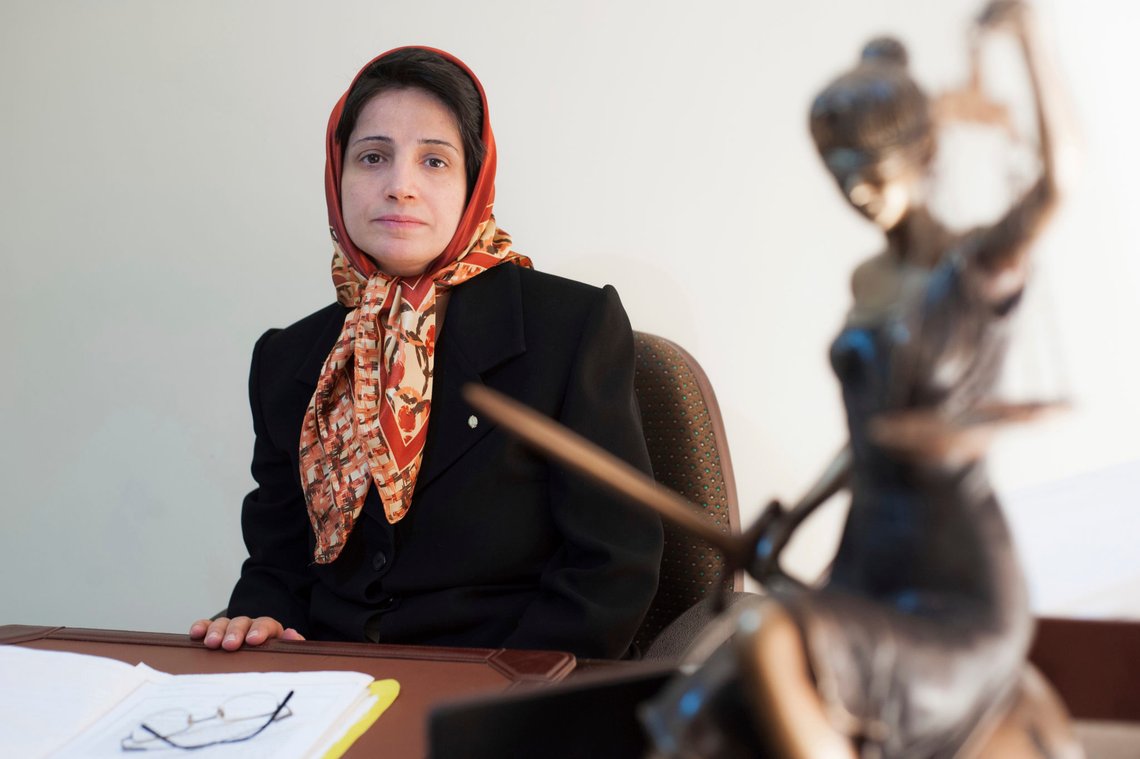 FILE - In this Nov. 1, 2008 photo, Iranian human rights lawyer Nasrin Sotoudeh, poses for a photograph in her office in Tehran, Iran. Iran's state-run news agency says on Saturday, Nov. 7, 2020, the leading Iranian human rights lawyer has been released from prison, a month after she was hospitalized amid a hunger-strike conducted from her cell. Sotoudeh was taken to hospital in mid-September, a month after launching her hunger strike seeking better prison conditions and the release of political prisoners amid the pandemic. (AP Photo/Arash Ashourinia) FILE - In this Nov. 1, 2008 photo, Iranian human rights lawyer Nasrin Sotoudeh, poses for a photograph in her office in Tehran, Iran. Iran's state-run news agency says on Saturday, Nov. 7, 2020, the leading Iranian human rights lawyer has been released from prison, a month after she was hospitalized amid a hunger-strike conducted from her cell. Sotoudeh was taken to hospital in mid-September, a month after launching her hunger strike seeking better prison conditions and the release of political prisoners amid the pandemic. (AP Photo/Arash Ashourinia)