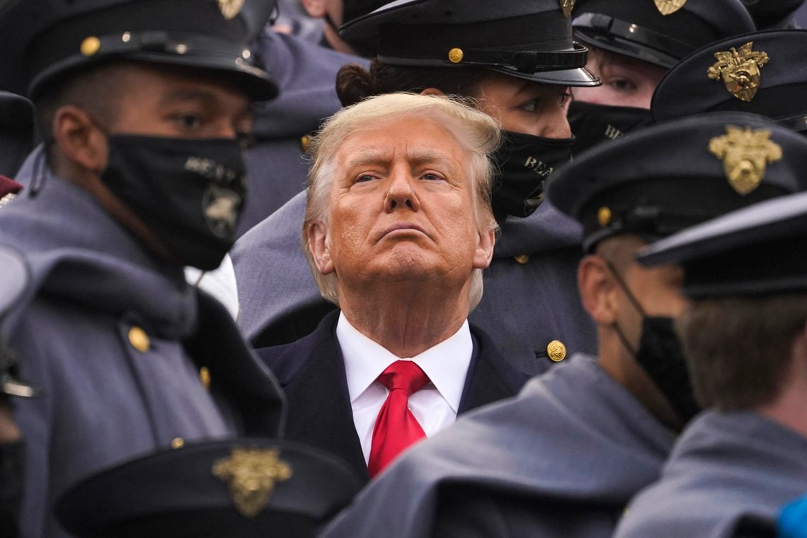 Surrounded by Army cadets, President Donald Trump watches the first half of the 121st Army-Navy Football Game in Michie Stadium at the United States Military Academy, Saturday, Dec. 12, 2020, in West Point, N.Y. (AP Photo/Andrew Harnik) Surrounded by Army cadets, President Donald Trump watches the first half of the 121st Army-Navy Football Game in Michie Stadium at the United States Military Academy, Saturday, Dec. 12, 2020, in West Point, N.Y. (AP Photo/Andrew Harnik)