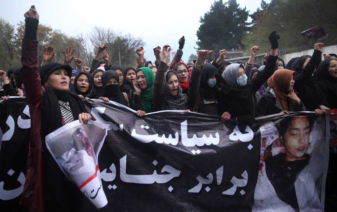 Women march and try to get inside the Presidential Palace in the Afghan capital of Kabul on Wednesday, Nov. 11, 2015, as they hold up pictures showing ethnic Hazaras who were allegedly killed by the Taliban, calling for a new government that can ensure security in the country. Written on the poster in Farsi reads: "Government should end its silence against Taliban crimes". Afghan presidential guards opened fire on Wednesday to disperse thousands of protesters marching outside the palace compound in Kabul to denounce recent abductions and killings of seven members of the Hazara Shiite minority. (AP Photos/Massoud Hossaini) Women march and try to get inside the Presidential Palace in the Afghan capital of Kabul on Wednesday, Nov. 11, 2015, as they hold up pictures showing ethnic Hazaras who were allegedly killed by the Taliban, calling for a new government that can ensure security in the country. Written on the poster in Farsi reads: "Government should end its silence against Taliban crimes". Afghan presidential guards opened fire on Wednesday to disperse thousands of protesters marching outside the palace compound in Kabul to denounce recent abductions and killings of seven members of the Hazara Shiite minority. (AP Photos/Massoud Hossaini)