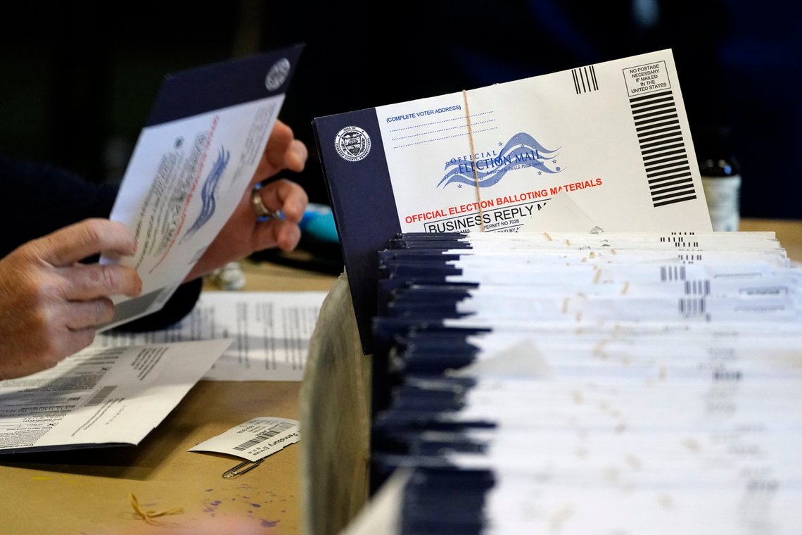 FILE - In this Nov. 4, 2020, file photo, Chester County, Pa. election workers process mail-in and absentee ballots at West Chester University in West Chester. Democrats plan to move quickly on one of the first bills of the new Congress, which would set federal election standards. The For the People Act would require states to offer early voting, same-day registration and the option of absentee voting for all registered voters. (AP Photo/Matt Slocum, File) FILE - In this Nov. 4, 2020, file photo, Chester County, Pa. election workers process mail-in and absentee ballots at West Chester University in West Chester. Democrats plan to move quickly on one of the first bills of the new Congress, which would set federal election standards. The For the People Act would require states to offer early voting, same-day registration and the option of absentee voting for all registered voters. (AP Photo/Matt Slocum, File)