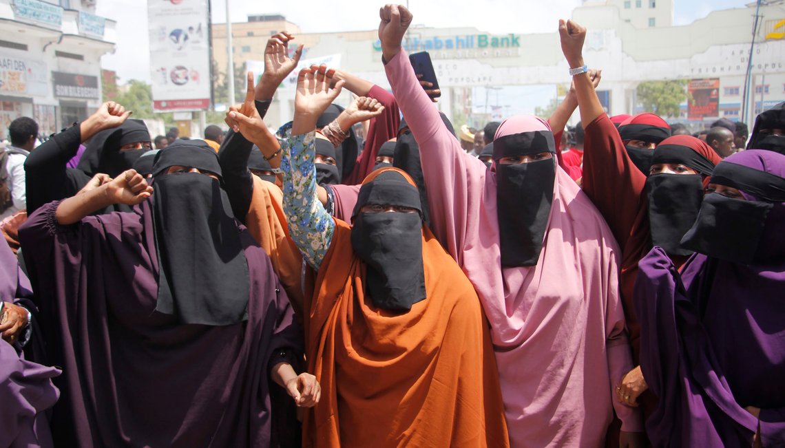 Hundreds hold a demonstration shouting slogans against French President Emmanuel Macron in Mogadishu, Somalia, Wednesday, Oct.28, 2020. Muslims in the Middle East and beyond are calling for boycotts of French products and for protests as a clash over depictions of the Prophet Muhammad and the limits of free speech intensifies. (AP Photo/Farah Abdi Warsameh) Hundreds hold a demonstration shouting slogans against French President Emmanuel Macron in Mogadishu, Somalia, Wednesday, Oct.28, 2020. Muslims in the Middle East and beyond are calling for boycotts of French products and for protests as a clash over depictions of the Prophet Muhammad and the limits of free speech intensifies. (AP Photo/Farah Abdi Warsameh)