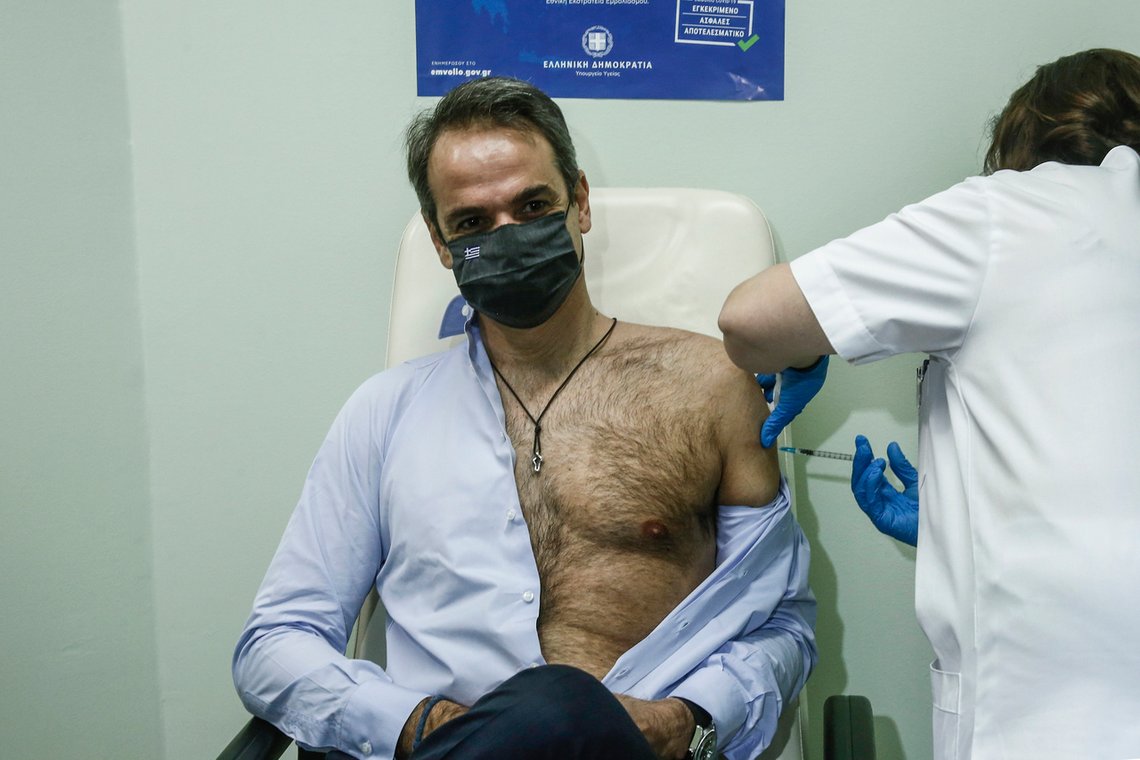 CORRECTS BYLINE Greek Prime Minister Kyriakos Mitsotakis receives a shot of the second dose of the Pfizer-BioNTech vaccine against the COVID-19 virus, at the Attikon University Hospital in Athens, Greece, on Monday Jan. 18, 2021. (Yannis Kolesidis/Pool via AP) CORRECTS BYLINE Greek Prime Minister Kyriakos Mitsotakis receives a shot of the second dose of the Pfizer-BioNTech vaccine against the COVID-19 virus, at the Attikon University Hospital in Athens, Greece, on Monday Jan. 18, 2021. (Yannis Kolesidis/Pool via AP)