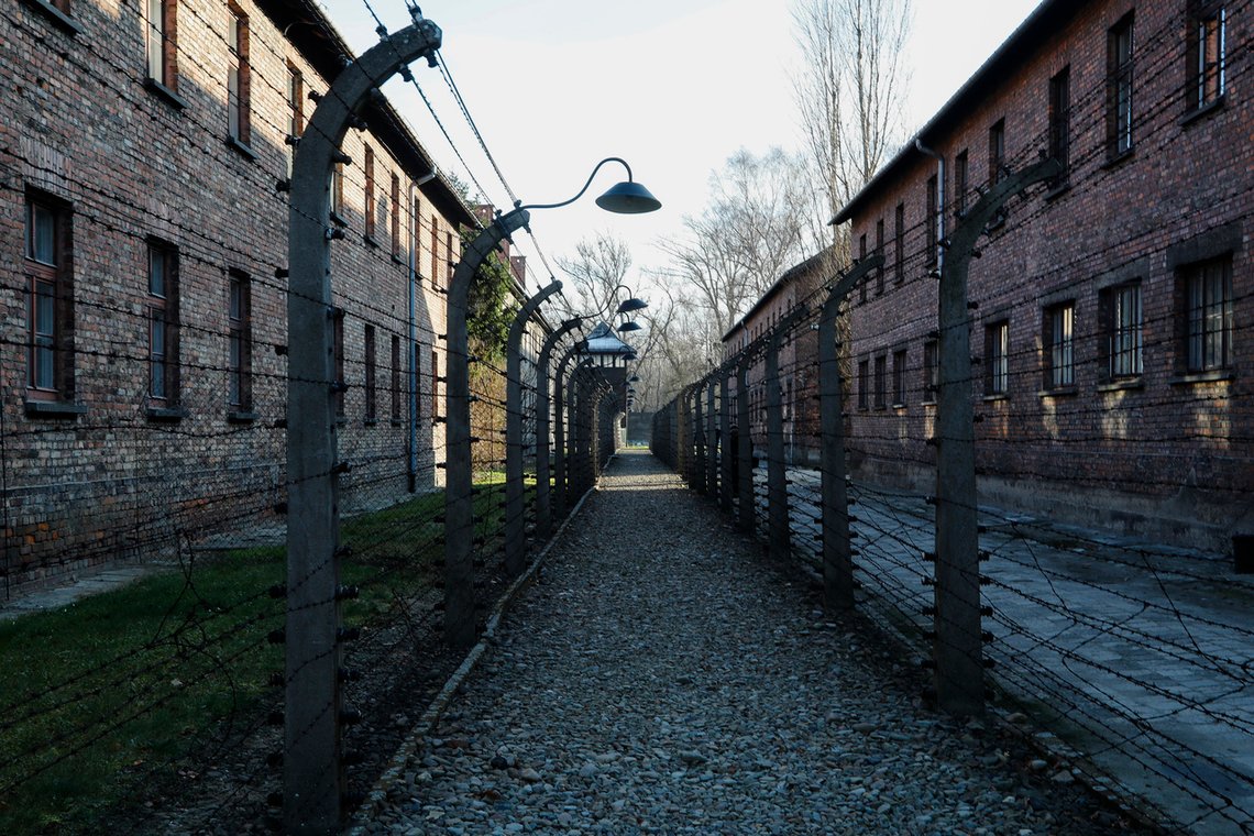 A pathway leading to an observation and security tower between what were electric barbed wire fences inside the former Nazi death camp of Auschwitz I in Oswiecim, Poland, Sunday, Dec. 8, 2019. The commemorations for the victims of the Holocaust at the International Holocaust Remembrance Day, marking the liberation of Auschwitz-Birkenau on Jan. 27, 1945, will be mostly online in 2021 due to the coronavirus pandemic. (AP Photo/Markus Schreiber) A pathway leading to an observation and security tower between what were electric barbed wire fences inside the former Nazi death camp of Auschwitz I in Oswiecim, Poland, Sunday, Dec. 8, 2019. The commemorations for the victims of the Holocaust at the International Holocaust Remembrance Day, marking the liberation of Auschwitz-Birkenau on Jan. 27, 1945, will be mostly online in 2021 due to the coronavirus pandemic. (AP Photo/Markus Schreiber)