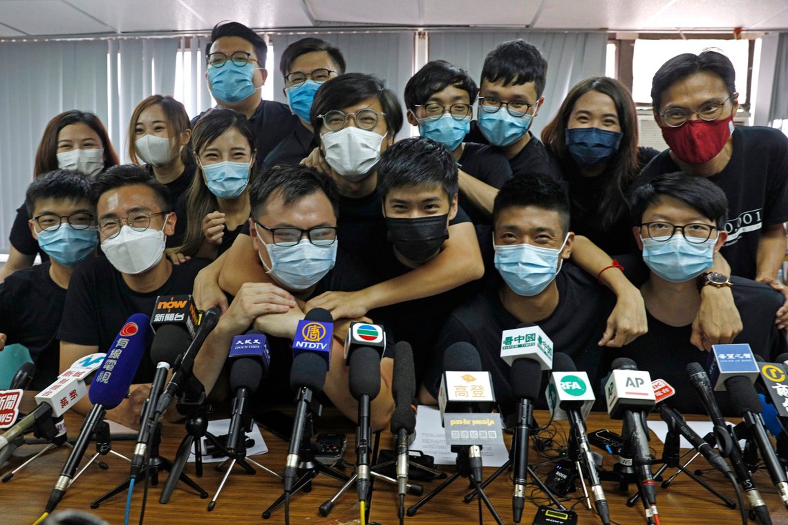 FILE - In this July 15, 2020, file photo, pro-democracy activists who were elected from unofficial pro-democracy primaries, including Joshua Wong, left, attend a press conference in Hong Kong. About 50 Hong Kong pro-democracy figures were arrested by police on Wednesday, Jan. 6, 2021 under a national security law, following their involvement in an unofficial primary election last year held to increase their chances of controlling the legislature, according to local media reports. (AP Photo/Kin Cheung, File) FILE - In this July 15, 2020, file photo, pro-democracy activists who were elected from unofficial pro-democracy primaries, including Joshua Wong, left, attend a press conference in Hong Kong. About 50 Hong Kong pro-democracy figures were arrested by police on Wednesday, Jan. 6, 2021 under a national security law, following their involvement in an unofficial primary election last year held to increase their chances of controlling the legislature, according to local media reports. (AP Photo/Kin Cheung, File)