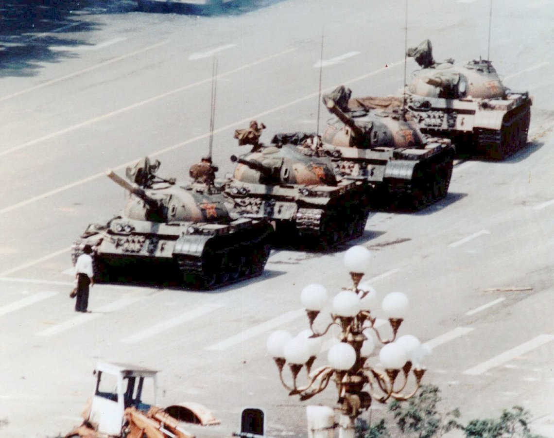 FILE--An anti-government protester stands in front of artillery tanks in Beijing's Tiananmen Square on June 5, 1989, at the height of the pro-democracy protests. Deng Xiaoping is believed to have given the final orders for the military suppression of the 1989 Tiananmen Square pro-democracy protests, which claimed hundreds, perhaps thousands of lives. Deng, the Communist revolutionary who guided China from political chaos and economic ruin toward prosperity in the post-Mao Tse-tung era, died Wednesday, Feb. 19, 1997. He was 93. (AP Photo/Jeff Widener) FILE--An anti-government protester stands in front of artillery tanks in Beijing's Tiananmen Square on June 5, 1989, at the height of the pro-democracy protests. Deng Xiaoping is believed to have given the final orders for the military suppression of the 1989 Tiananmen Square pro-democracy protests, which claimed hundreds, perhaps thousands of lives. Deng, the Communist revolutionary who guided China from political chaos and economic ruin toward prosperity in the post-Mao Tse-tung era, died Wednesday, Feb. 19, 1997. He was 93. (AP Photo/Jeff Widener)