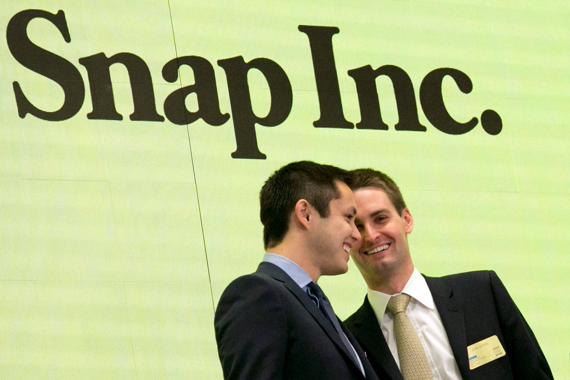 FILE - In this Thursday, March 2, 2017, file photo, Snapchat co-founders Bobby Murphy, left, and CEO Evan Spiegel ring the opening bell at the New York Stock Exchange as the company celebrates its IPO. Since it couldn?Äôt buy its smaller rival, Facebook is bent on copying Snap to death. Snap Inc., the company behind Snapchat, meanwhile, is intent on forging ahead against its much bigger rival, courting older users, keeping young ones and along with them, advertisers. (AP Photo/Richard Drew, File) FILE - In this Thursday, March 2, 2017, file photo, Snapchat co-founders Bobby Murphy, left, and CEO Evan Spiegel ring the opening bell at the New York Stock Exchange as the company celebrates its IPO. Since it couldn?Äôt buy its smaller rival, Facebook is bent on copying Snap to death. Snap Inc., the company behind Snapchat, meanwhile, is intent on forging ahead against its much bigger rival, courting older users, keeping young ones and along with them, advertisers. (AP Photo/Richard Drew, File)