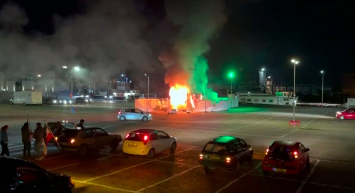 In this image made from video, a COVID-19 testing center is seen after being set on fire in Urk, 80 kilometers (50 miles) northeast of Amsterdam, Saturday, Jan. 23, 2021. Dutch police have clashed with protesters demonstrating against the countrys lockdown in the capital, Amsterdam and the southern city of Eindhoven. The unrest comes a day after rioting youths protesting on the first night of the countrys curfew torched a coronavirus testing facility in Dutch fishing village Urk. (Pro News via AP) In this image made from video, a COVID-19 testing center is seen after being set on fire in Urk, 80 kilometers (50 miles) northeast of Amsterdam, Saturday, Jan. 23, 2021. Dutch police have clashed with protesters demonstrating against the countrys lockdown in the capital, Amsterdam and the southern city of Eindhoven. The unrest comes a day after rioting youths protesting on the first night of the countrys curfew torched a coronavirus testing facility in Dutch fishing village Urk. (Pro News via AP)