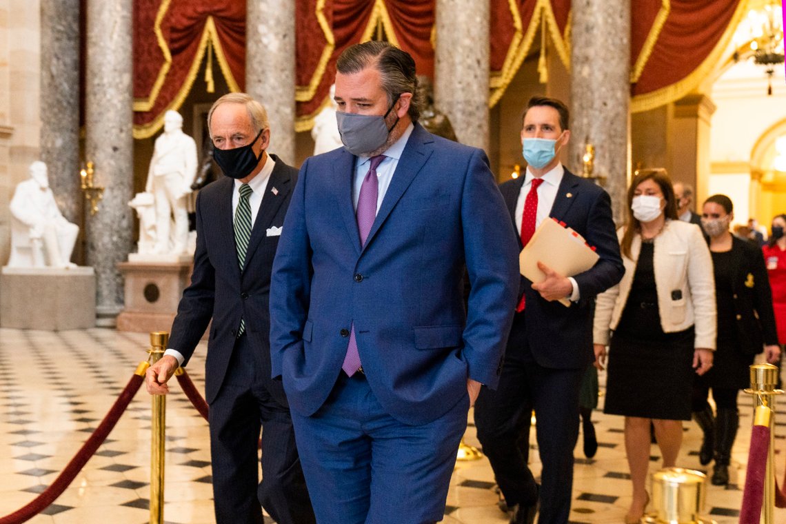 Sen. Ted Cruz, R-Texas, front, followed by Sen. Josh Hawley, R-Mo., walk from the House Chamber following a Senate procession carrying boxes holding Electoral College votes to the House Chamber for a joint session to confirm the Electoral College votes, Wednesday, Jan. 6, 2021, in Washington. (AP Photo/Manuel Balce Ceneta) Sen. Ted Cruz, R-Texas, front, followed by Sen. Josh Hawley, R-Mo., walk from the House Chamber following a Senate procession carrying boxes holding Electoral College votes to the House Chamber for a joint session to confirm the Electoral College votes, Wednesday, Jan. 6, 2021, in Washington. (AP Photo/Manuel Balce Ceneta)