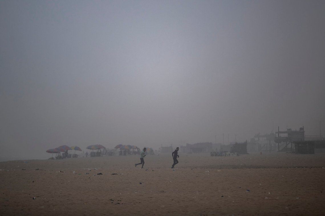 Palestinians exercise during a foggy morning on the beach of Gaza City, Tuesday, Jan. 5, 2021. (AP Photo/Khalil Hamra) Palestinians exercise during a foggy morning on the beach of Gaza City, Tuesday, Jan. 5, 2021. (AP Photo/Khalil Hamra)