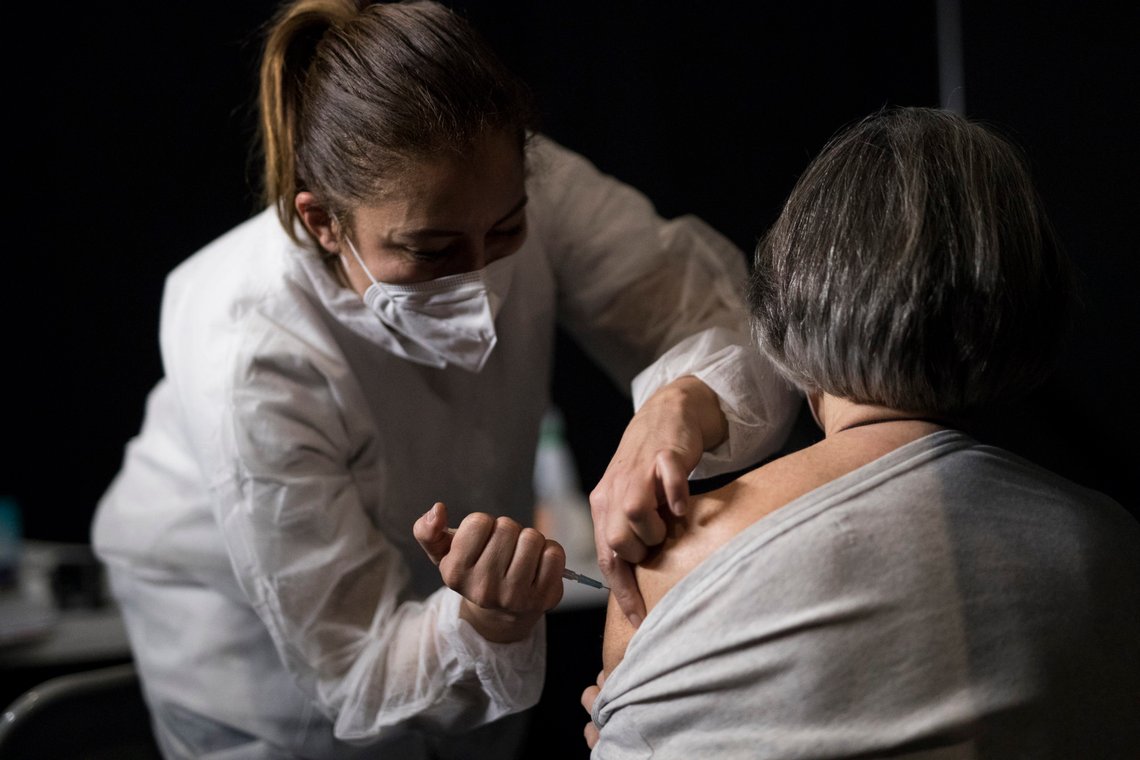 A woman receives a dose of the Moderna COVID-19 vaccine at a vaccination center in Le Cannet, southern France, Thursday Jan. 21, 2021. (AP Photo/Daniel Cole) A woman receives a dose of the Moderna COVID-19 vaccine at a vaccination center in Le Cannet, southern France, Thursday Jan. 21, 2021. (AP Photo/Daniel Cole)