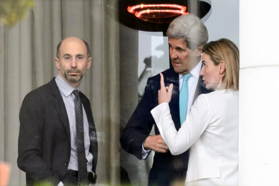 FILE - In this April 1, 2015, file photo, High Representative of the European Union for Foreign Affairs and Security Policy Federica Mogherini, right, speaks with U.S. Secretary of State John Kerry, center, and Robert Malley, left, Senior Director for Iran, Iraq, and the Gulf States, National Security Council during a break outside the hotel at the Beau Rivage Palace Hotel as the Iran nuclear talks continue, in Lausanne, Switzerland. President Barack Obama?s new ?ISIS czar,? Malley, has a long and sometimes controversial history at the center of U.S. policymaking in the Middle East. He?s now taking on one of the toughest jobs in Washington: getting the struggling campaign against Islamic State militants on track while Obama refuses to entertain any wholesale strategy change. (AP Photo/Keystone, Laurent Gillieron, File) FILE - In this April 1, 2015, file photo, High Representative of the European Union for Foreign Affairs and Security Policy Federica Mogherini, right, speaks with U.S. Secretary of State John Kerry, center, and Robert Malley, left, Senior Director for Iran, Iraq, and the Gulf States, National Security Council during a break outside the hotel at the Beau Rivage Palace Hotel as the Iran nuclear talks continue, in Lausanne, Switzerland. President Barack Obama?s new ?ISIS czar,? Malley, has a long and sometimes controversial history at the center of U.S. policymaking in the Middle East. He?s now taking on one of the toughest jobs in Washington: getting the struggling campaign against Islamic State militants on track while Obama refuses to entertain any wholesale strategy change. (AP Photo/Keystone, Laurent Gillieron, File)