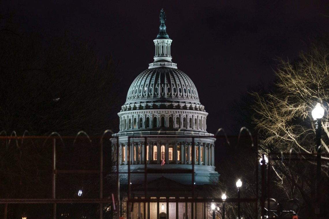The Capitol is seen behind reinforced barricades as the second impeachment trial of former President Donald Trump begins in the Senate in Washington, Tuesday, Feb. 9, 2021. Trump was charged by the House with incitement of insurrection for his role in agitating a violent mob of his supporters that laid siege to the U.S. Capitol on Jan. 6, and sent members of Congress into hiding as they met to validate President Joe Biden's victory. (AP Photo/J. Scott Applewhite) The Capitol is seen behind reinforced barricades as the second impeachment trial of former President Donald Trump begins in the Senate in Washington, Tuesday, Feb. 9, 2021. Trump was charged by the House with incitement of insurrection for his role in agitating a violent mob of his supporters that laid siege to the U.S. Capitol on Jan. 6, and sent members of Congress into hiding as they met to validate President Joe Biden's victory. (AP Photo/J. Scott Applewhite)