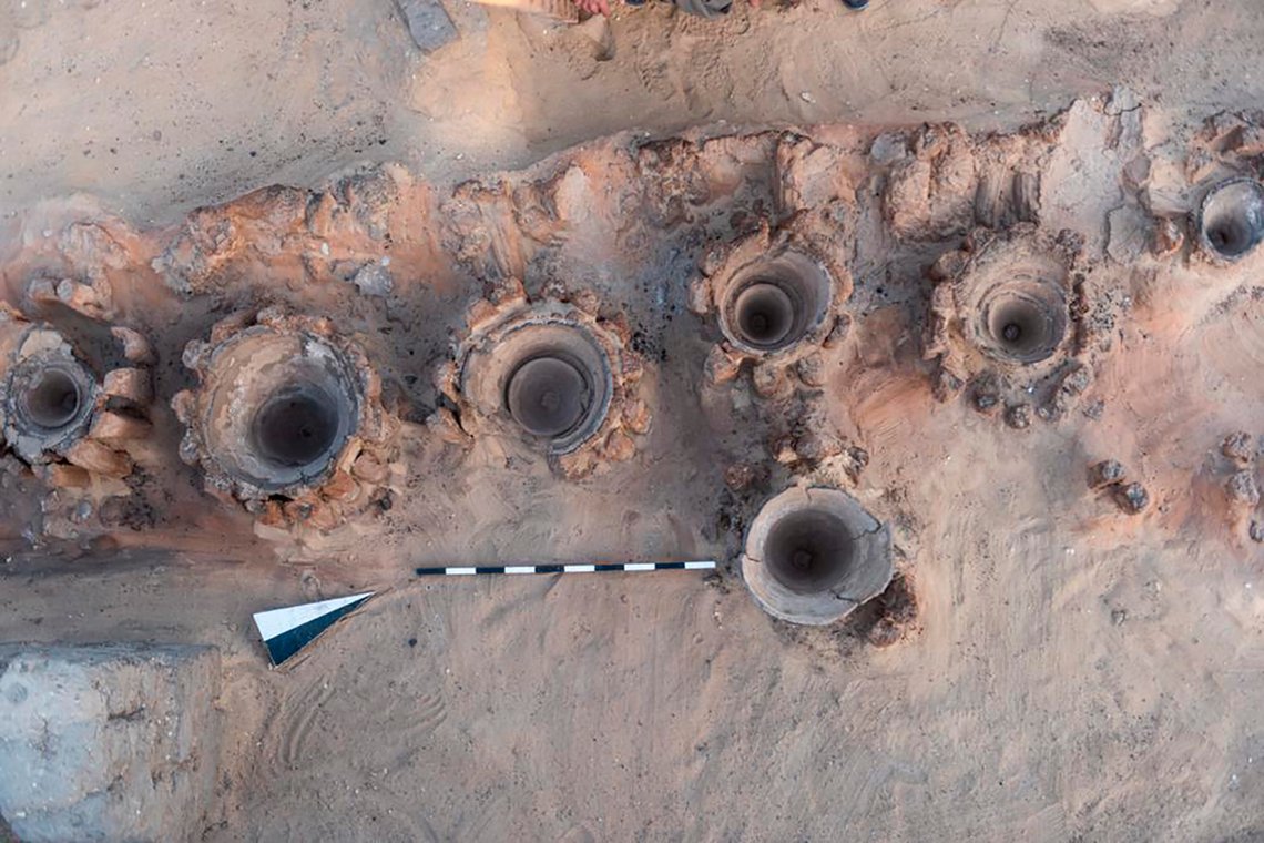 This photo provided by the Egyptian Antiquities Ministry on Saturday, Feb. 13, 2021 shows pottery basins, which archaeologists say had been used to heat up a mixture of grains and water to produce beer, in Abydos, some 450 km (280 miles) south of Cairo, Egypt. The basins were part of what could be the oldest known beer factory unearthed in Abydos, an ancient burial ground dating back to the region of King Narmer, the last king of the Predynastic Period (6000 - 3150 B.C.), according to Mostafa Waziri, secretary general of the Supreme Council of Antiquities. (Egyptian Antiquities Ministry via AP) This photo provided by the Egyptian Antiquities Ministry on Saturday, Feb. 13, 2021 shows pottery basins, which archaeologists say had been used to heat up a mixture of grains and water to produce beer, in Abydos, some 450 km (280 miles) south of Cairo, Egypt. The basins were part of what could be the oldest known beer factory unearthed in Abydos, an ancient burial ground dating back to the region of King Narmer, the last king of the Predynastic Period (6000 - 3150 B.C.), according to Mostafa Waziri, secretary general of the Supreme Council of Antiquities. (Egyptian Antiquities Ministry via AP)