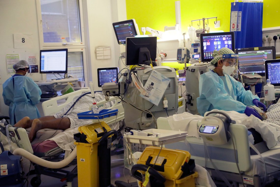 Critical Care staff take care of COVID-19 patients on the Christine Brown ward at King's College Hospital in London, Wednesday, Jan. 27, 2021. (AP Photo/Kirsty Wigglesworth, pool) Critical Care staff take care of COVID-19 patients on the Christine Brown ward at King's College Hospital in London, Wednesday, Jan. 27, 2021. (AP Photo/Kirsty Wigglesworth, pool)