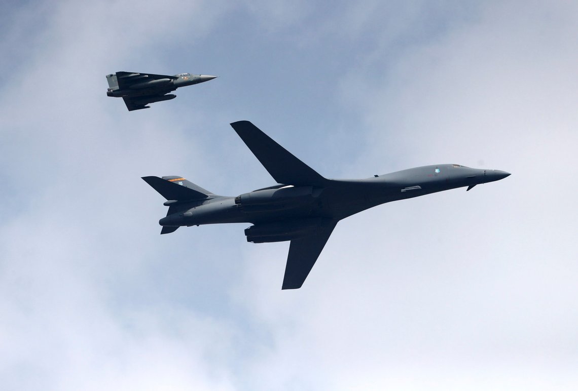 A U.S. Air Force B-1B Lancer bomber, right, flies with an Indian Air Force light combat aircraft Tejas on the inaugural day of Aero India 2021 at Yelahanka air base in Bengaluru, India, Wednesday, Feb. 3, 2021. Aero India is a biennial event with flying demonstrations by stunt teams and militaries and commercial pavilions where aviation companies display their products and technology. (AP Photo/Aijaz Rahi) A U.S. Air Force B-1B Lancer bomber, right, flies with an Indian Air Force light combat aircraft Tejas on the inaugural day of Aero India 2021 at Yelahanka air base in Bengaluru, India, Wednesday, Feb. 3, 2021. Aero India is a biennial event with flying demonstrations by stunt teams and militaries and commercial pavilions where aviation companies display their products and technology. (AP Photo/Aijaz Rahi)