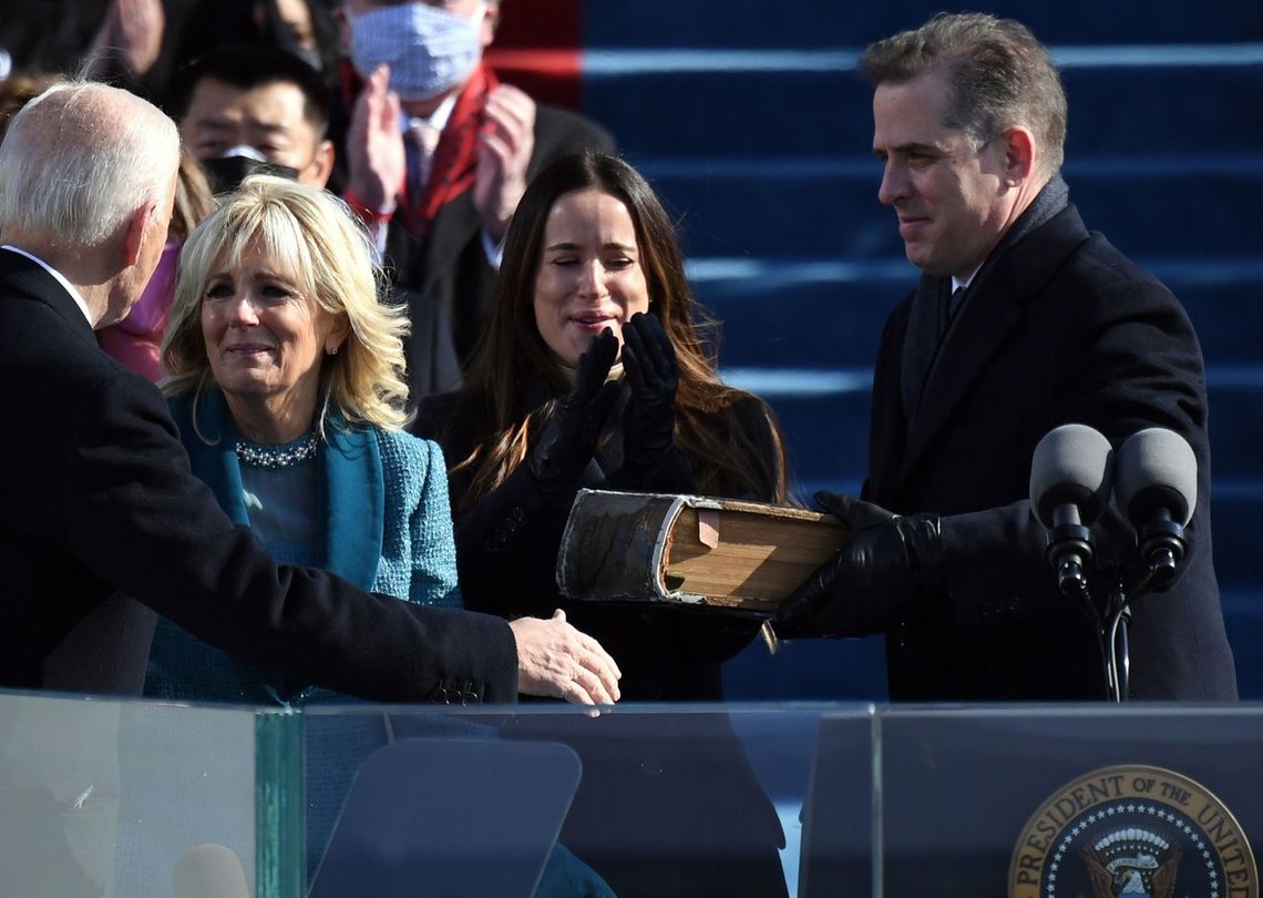 (FILES) In this file photo taken on January 20, 2021, Hunter Biden (R) hands the Bible to incoming US First Lady Jill Biden (C) as Joe Biden is sworn in as the 46th US President at the US Capitol in Washington, DC. - President Joe Biden's son Hunter will detail his struggles with alcohol and drug addiction in a memoir scheduled for release in April, publisher Gallery Books announced on on February 4, 2021. (Photo by ANDREW CABALLERO-REYNOLDS / AFP) (FILES) In this file photo taken on January 20, 2021, Hunter Biden (R) hands the Bible to incoming US First Lady Jill Biden (C) as Joe Biden is sworn in as the 46th US President at the US Capitol in Washington, DC. - President Joe Biden's son Hunter will detail his struggles with alcohol and drug addiction in a memoir scheduled for release in April, publisher Gallery Books announced on on February 4, 2021. (Photo by ANDREW CABALLERO-REYNOLDS / AFP)