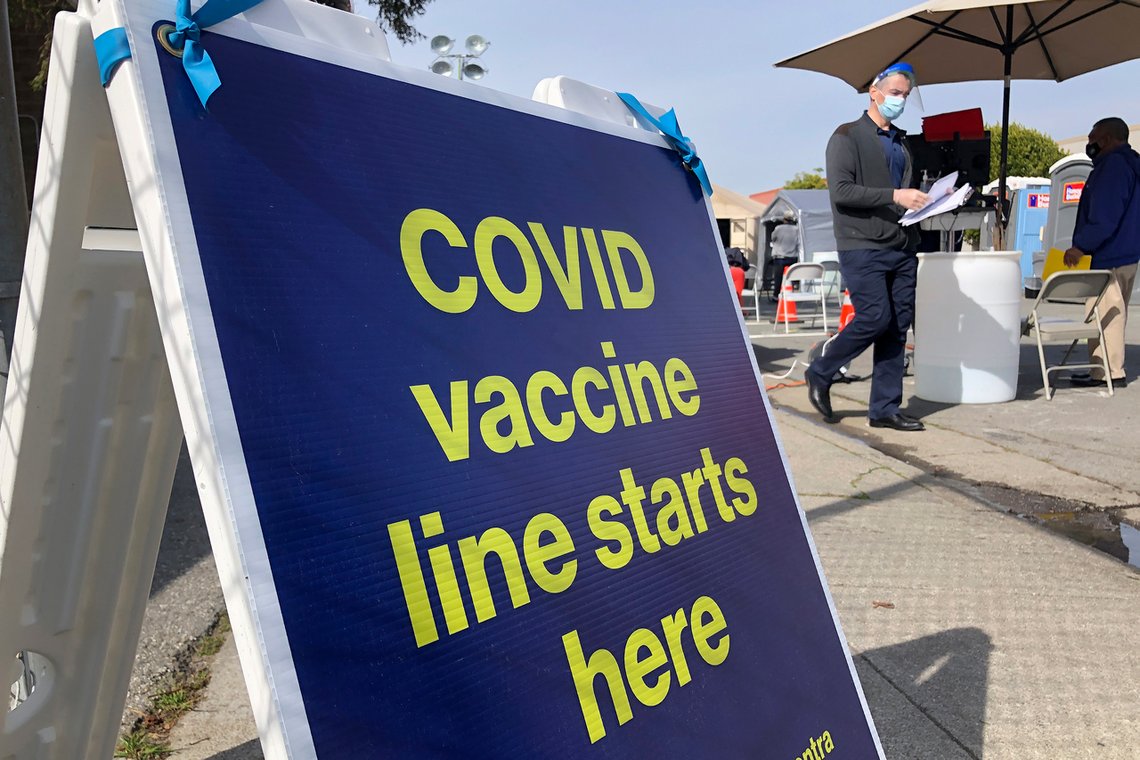 A sign is shown at a COVID-19 vaccine site in the Bayview neighborhood of San Francisco, Monday, Feb. 8, 2021. Counties in California and other places in the U.S. are trying to ensure they vaccinate people in largely Black, Latino and working-class communities that have borne the brunt of the coronavirus pandemic. San Francisco is reserving some vaccines for seniors in the two ZIP codes hit hardest by the pandemic. (AP Photo/Haven Daley) A sign is shown at a COVID-19 vaccine site in the Bayview neighborhood of San Francisco, Monday, Feb. 8, 2021. Counties in California and other places in the U.S. are trying to ensure they vaccinate people in largely Black, Latino and working-class communities that have borne the brunt of the coronavirus pandemic. San Francisco is reserving some vaccines for seniors in the two ZIP codes hit hardest by the pandemic. (AP Photo/Haven Daley)
