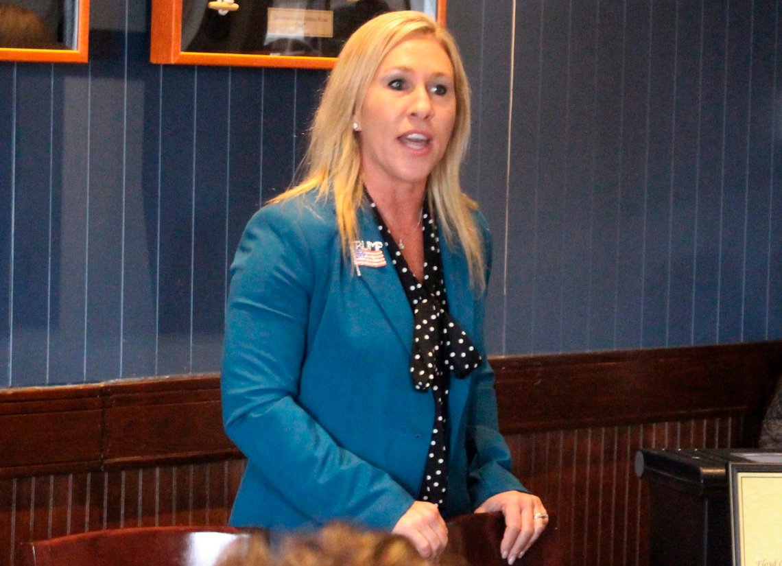 FILE - In this March 3, 2020, file photo, Republican Marjorie Taylor Greene speaks to a GOP women's group in Rome, Ga. The Democratic candidate running against Republican Marjorie Taylor Greene, who has expressed support for the QAnon conspiracy theory and been criticized for other incendiary comments, is dropping out of their race for a U.S. House seat representing northwest Georgia. Democrat Kevin Van Ausdal bowed out of the race on Friday, Sept. 11, 2020. (John Bailey/The Rome News-Tribune via AP, File) FILE - In this March 3, 2020, file photo, Republican Marjorie Taylor Greene speaks to a GOP women's group in Rome, Ga. The Democratic candidate running against Republican Marjorie Taylor Greene, who has expressed support for the QAnon conspiracy theory and been criticized for other incendiary comments, is dropping out of their race for a U.S. House seat representing northwest Georgia. Democrat Kevin Van Ausdal bowed out of the race on Friday, Sept. 11, 2020. (John Bailey/The Rome News-Tribune via AP, File)