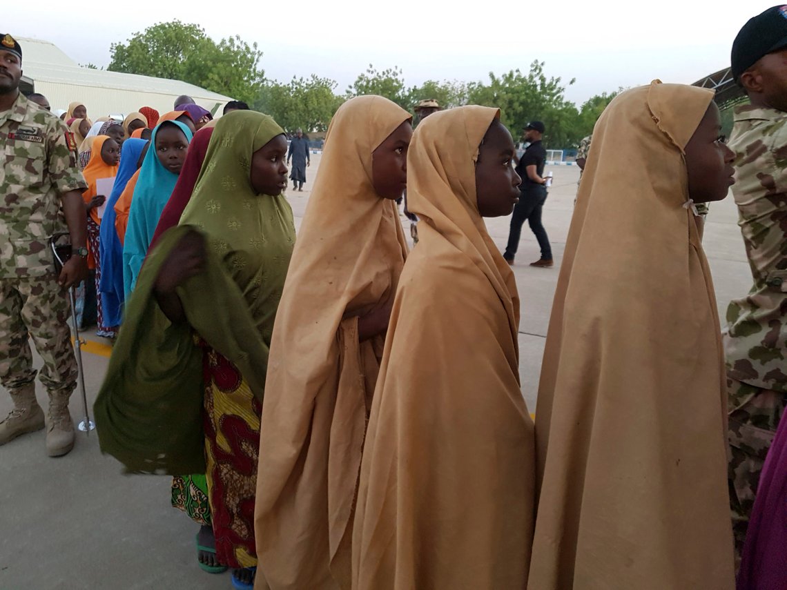 The girls from the Government Girls Science and Technical College Dapchi who were kidnapped and set free board a Military plane following a hand over to government officials in Maiduguri, Nigeria, Wednesday March. 21, 2018. Witnesses say Boko Haram militants have returned an unknown number of the 110 girls who were abducted from their Nigeria school a month ago. (AP Photo/Hamza Suleiman) The girls from the Government Girls Science and Technical College Dapchi who were kidnapped and set free board a Military plane following a hand over to government officials in Maiduguri, Nigeria, Wednesday March. 21, 2018. Witnesses say Boko Haram militants have returned an unknown number of the 110 girls who were abducted from their Nigeria school a month ago. (AP Photo/Hamza Suleiman)
