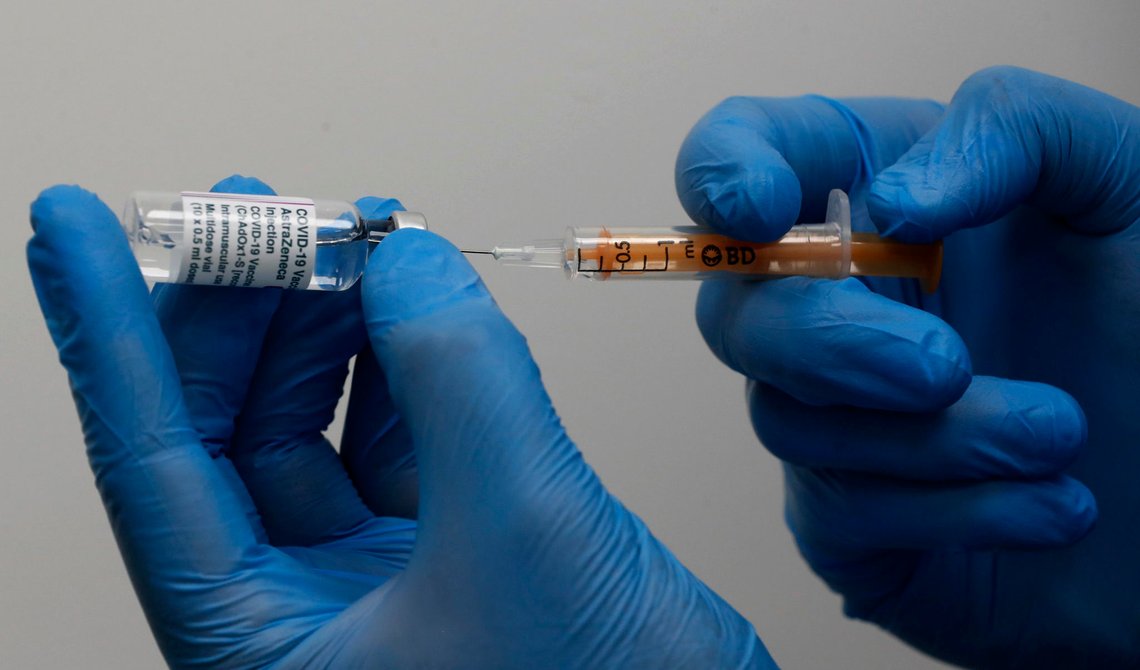 Doctor Khizer Hanif prepares the AstraZeneca vaccine at a Pharmacy in Edgeware, London, Tuesday, March 16, 2021, as Britain continues use of the vaccine. In recent days, countries including Denmark, Ireland and Thailand have temporarily suspended the use of AstraZeneca's coronavirus vaccine after reports that some people who got a dose developed blood clots, even though there's no evidence that the shot was responsible. The European Medicines Agency and the World Health Organization say the data available do not suggest the vaccine caused the clots.? (AP Photo/Frank Augstein) Doctor Khizer Hanif prepares the AstraZeneca vaccine at a Pharmacy in Edgeware, London, Tuesday, March 16, 2021, as Britain continues use of the vaccine. In recent days, countries including Denmark, Ireland and Thailand have temporarily suspended the use of AstraZeneca's coronavirus vaccine after reports that some people who got a dose developed blood clots, even though there's no evidence that the shot was responsible. The European Medicines Agency and the World Health Organization say the data available do not suggest the vaccine caused the clots.? (AP Photo/Frank Augstein)