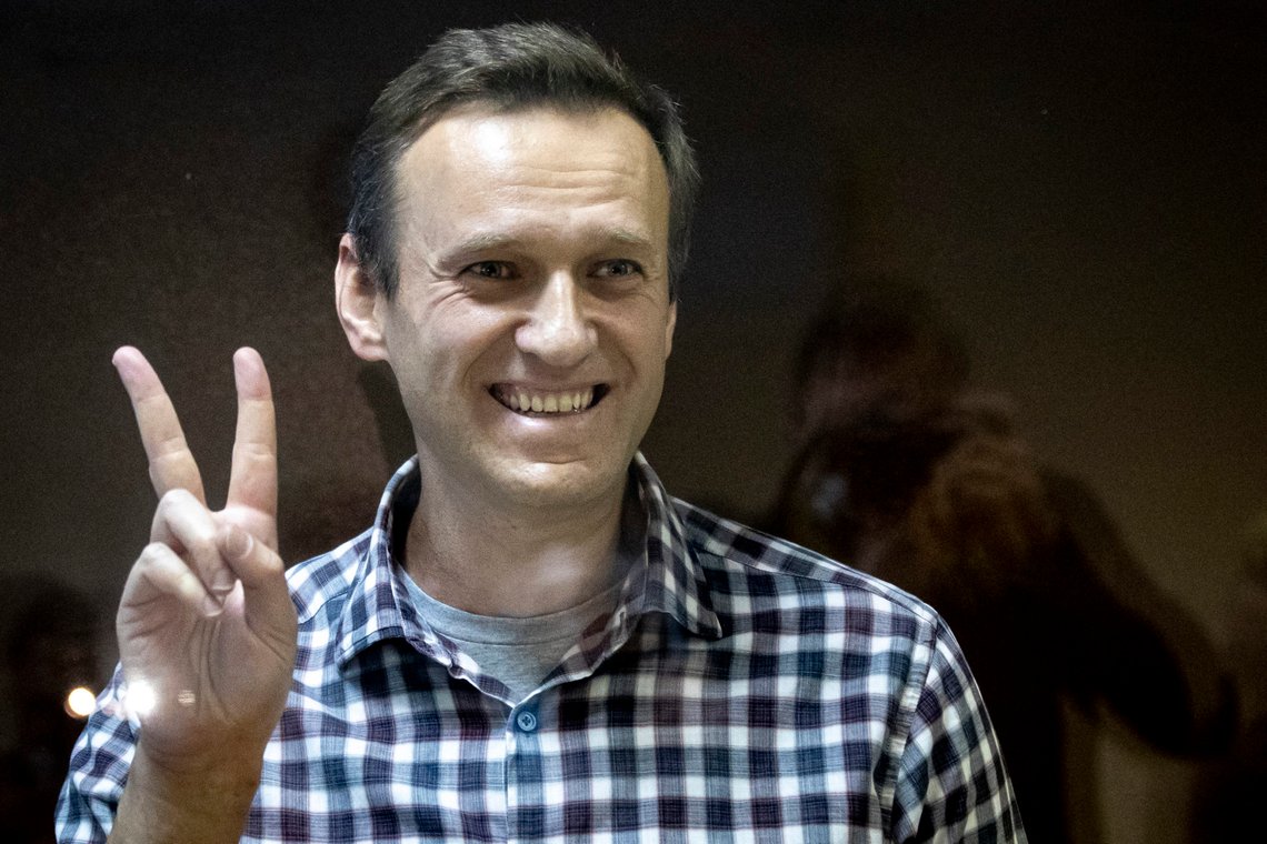 FILE - In this Saturday, Feb. 20, 2021 file photo, Russian opposition leader Alexei Navalny gestures as he stands behind a grass of the cage in the Babuskinsky District Court in Moscow, Russia. Russian opposition leader Alexey Navalny was transported to a prison 100km away from Moscow. Navalny was taken to a prison in Pokrov city after Moscow city court rejected appeal against his prison sentence on Saturday, Feb. 27, 2021. (AP Photo/Alexander Zemlianichenko, File) FILE - In this Saturday, Feb. 20, 2021 file photo, Russian opposition leader Alexei Navalny gestures as he stands behind a grass of the cage in the Babuskinsky District Court in Moscow, Russia. Russian opposition leader Alexey Navalny was transported to a prison 100km away from Moscow. Navalny was taken to a prison in Pokrov city after Moscow city court rejected appeal against his prison sentence on Saturday, Feb. 27, 2021. (AP Photo/Alexander Zemlianichenko, File)