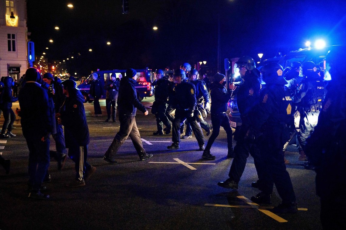 A photo taken on January 9, 2021 shows police dispersing protesters during an anti-lockdown demonstration organized by the Men In Black movement in Copenhagen. - A 30-year-old woman and mother of two was sentenced on March 12, 2021 to two years in prison for inciting violence during a speech at the beginning of the anti-lockdown protests on January 9, 2021. During her speech she reportedly encouraged protesters to 'destroy the city in a non-violent way'. (Photo by Philip Davali / Ritzau Scanpix / AFP) / Denmark OUT A photo taken on January 9, 2021 shows police dispersing protesters during an anti-lockdown demonstration organized by the Men In Black movement in Copenhagen. - A 30-year-old woman and mother of two was sentenced on March 12, 2021 to two years in prison for inciting violence during a speech at the beginning of the anti-lockdown protests on January 9, 2021. During her speech she reportedly encouraged protesters to 'destroy the city in a non-violent way'. (Photo by Philip Davali / Ritzau Scanpix / AFP) / Denmark OUT