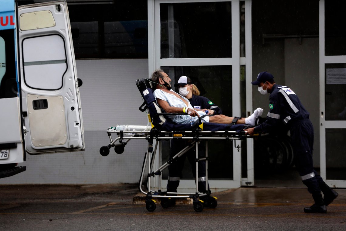 Healthcare workers receive a patient suspected of having COVID-19 at the public HRAN Hospital in Brasilia, Brazil, Monday, March 8, 2021. (AP Photo/Eraldo Peres) Healthcare workers receive a patient suspected of having COVID-19 at the public HRAN Hospital in Brasilia, Brazil, Monday, March 8, 2021. (AP Photo/Eraldo Peres)