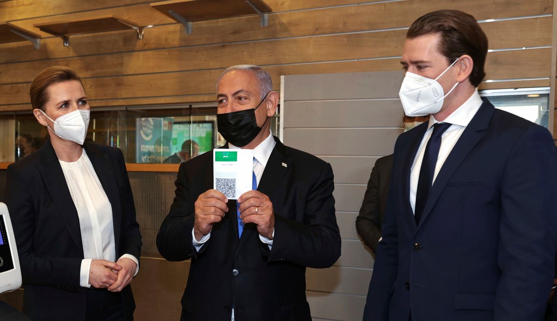 Israeli Prime Minister Benjamin Netanyahu, center, holds a "Green Pass," for citizens vaccinated against COVID-19, as he visits a fitness gym with Austrian Chancellor Sebastian Kurz, right, and Danish Prime Minister Mette Frederiksen, to observe how the pass is used, in Modi'in, Israel, Thursday, March 4, 2021. Frederiksen and Kurz are on a short visit to Israel for to pursue the possibilities for closer cooperation on COVID-19 and vaccines. (Avigail Uzi/Pool via AP) Israeli Prime Minister Benjamin Netanyahu, center, holds a "Green Pass," for citizens vaccinated against COVID-19, as he visits a fitness gym with Austrian Chancellor Sebastian Kurz, right, and Danish Prime Minister Mette Frederiksen, to observe how the pass is used, in Modi'in, Israel, Thursday, March 4, 2021. Frederiksen and Kurz are on a short visit to Israel for to pursue the possibilities for closer cooperation on COVID-19 and vaccines. (Avigail Uzi/Pool via AP)