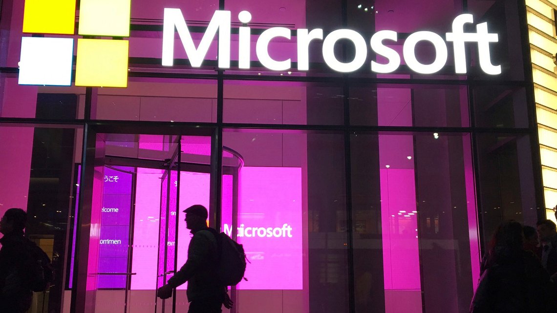 FILE - In this Nov. 10, 2016, file photo, people walk past a Microsoft office in New York. China-based government hackers have exploited a bug in Microsoft's email server software to target U.S. organizations, the company said Tuesday, March 2, 2021. (AP Photo/Swayne B. Hall, File) FILE - In this Nov. 10, 2016, file photo, people walk past a Microsoft office in New York. China-based government hackers have exploited a bug in Microsoft's email server software to target U.S. organizations, the company said Tuesday, March 2, 2021. (AP Photo/Swayne B. Hall, File)