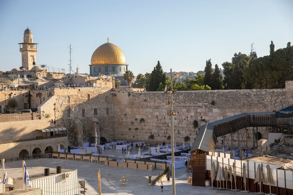 The Dome of the Rock and al-Aqsa mosque compound on the left and with social distancing barriers, ultra-Orthodox Jewish men pray ahead of Yom Kippur, the holiest day in the Jewish year which starts at sundown Sunday during a three-week nationwide lockdown to curb the spread of the coronavirus at the Western Wall, the holiest site where Jews can pray in Jerusalem's old city, Sunday, Sept. 27, 2020. The solemn Jewish holiday of Yom Kippur, which annually sees Israeli life grind to a halt, arrived on Sunday in a nation already under a sweeping coronavirus lockdown. (AP Photo/Ariel Schalit) The Dome of the Rock and al-Aqsa mosque compound on the left and with social distancing barriers, ultra-Orthodox Jewish men pray ahead of Yom Kippur, the holiest day in the Jewish year which starts at sundown Sunday during a three-week nationwide lockdown to curb the spread of the coronavirus at the Western Wall, the holiest site where Jews can pray in Jerusalem's old city, Sunday, Sept. 27, 2020. The solemn Jewish holiday of Yom Kippur, which annually sees Israeli life grind to a halt, arrived on Sunday in a nation already under a sweeping coronavirus lockdown. (AP Photo/Ariel Schalit)