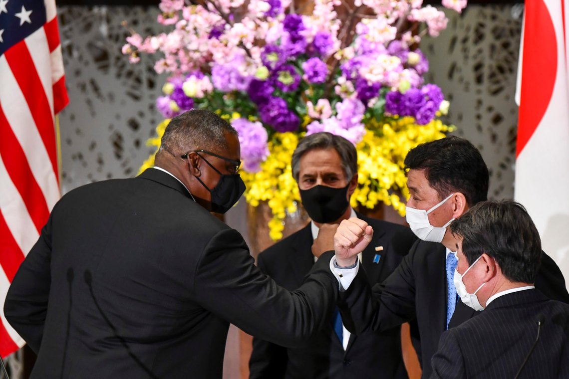 U.S. Defense Secretary Lloyd Austin, left, elbow bumps with Japanese Defense Minister Nobuo Kishi as U.S. Secretary of State Antony Blinken, center, and Japan's Foreign Minister Toshimitsu Motegi, front, watch after a joint news conference after their two plus two security talks at Iikura Guest House in Tokyo Tuesday, March 16, 2021. Defense and foreign ministers from the U.S. and Japan are meeting to discuss their concern over China's growing influence in the Indo-Pacific region as the Biden administration tries to reaffirm engagement with its key regional allies.(Kazuhiro Nogi/Pool Photo via AP) U.S. Defense Secretary Lloyd Austin, left, elbow bumps with Japanese Defense Minister Nobuo Kishi as U.S. Secretary of State Antony Blinken, center, and Japan's Foreign Minister Toshimitsu Motegi, front, watch after a joint news conference after their two plus two security talks at Iikura Guest House in Tokyo Tuesday, March 16, 2021. Defense and foreign ministers from the U.S. and Japan are meeting to discuss their concern over China's growing influence in the Indo-Pacific region as the Biden administration tries to reaffirm engagement with its key regional allies.(Kazuhiro Nogi/Pool Photo via AP)