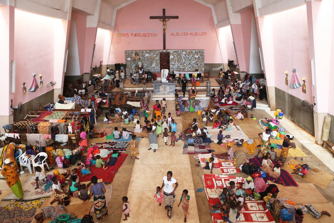 Women and children shelter inside a Roman Catholic Church in Pemba city on the northeastern coast of Mozambique in this Monday, April, 29, 2019 photo. Situated in the heart of an ethnically diverse city ravaged by Cyclone Kenneth, the Maria Auxiladora parish is housing close to 1000 people displaced by the storm which according to aid agencies has affected Cabo Delgado the country's northern province.(AP Photo/Tsvangirayi Mukwazhi) Women and children shelter inside a Roman Catholic Church in Pemba city on the northeastern coast of Mozambique in this Monday, April, 29, 2019 photo. Situated in the heart of an ethnically diverse city ravaged by Cyclone Kenneth, the Maria Auxiladora parish is housing close to 1000 people displaced by the storm which according to aid agencies has affected Cabo Delgado the country's northern province.(AP Photo/Tsvangirayi Mukwazhi)