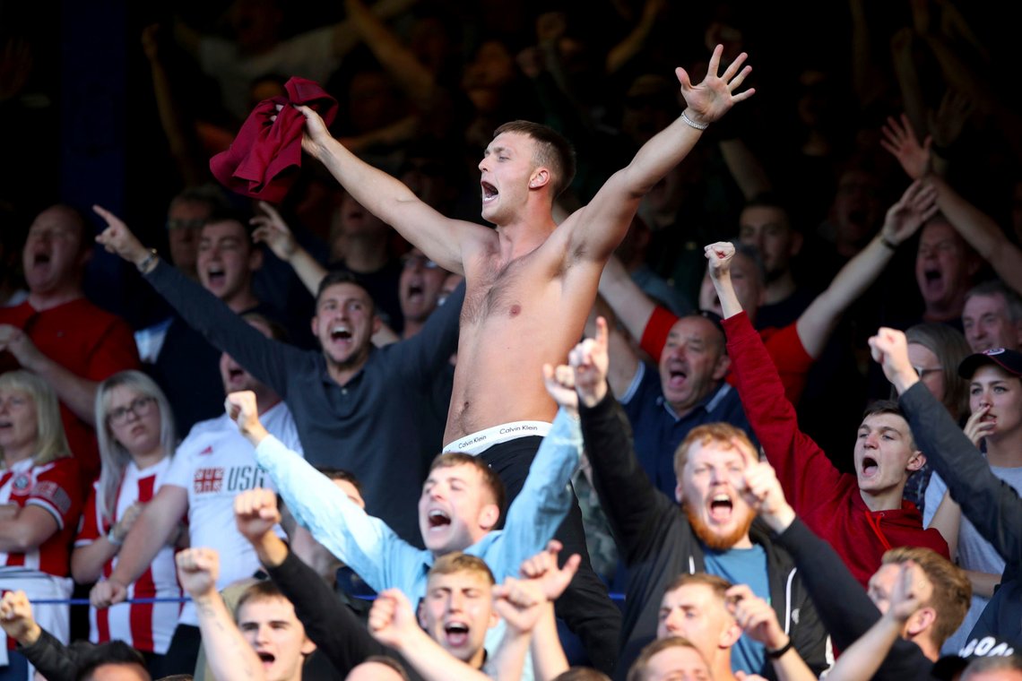 Sheffield United fans show their support in the stands during the English Premier League soccer match between Everton and Sheffield United at the Goodison Park Stadium, Liverpool, England. Saturday, Sept 21 2019. (Nick Potts/PA via AP) Sheffield United fans show their support in the stands during the English Premier League soccer match between Everton and Sheffield United at the Goodison Park Stadium, Liverpool, England. Saturday, Sept 21 2019. (Nick Potts/PA via AP)