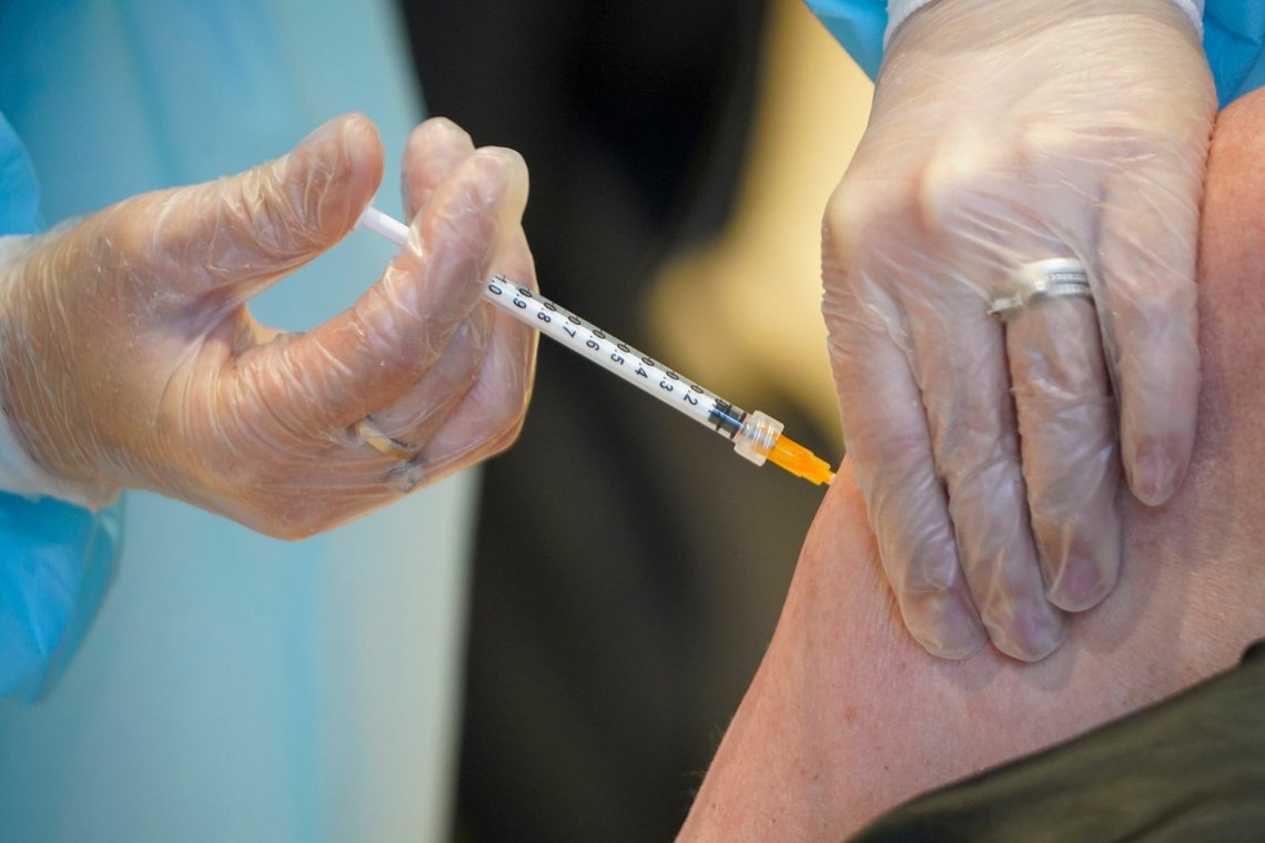 A health worker administers a dose of the AstraZeneca vaccine against COVID-19 to a patient inside the convention center known as "La Nuvola", The Cloud, in Rome, Wednesday, March 10, 2021. The visually extraordinary complex designed by famed architect Massimiliano Fuksas has been transformed into a temporary vaccination center. (AP Photo/Andrew Medichini) A health worker administers a dose of the AstraZeneca vaccine against COVID-19 to a patient inside the convention center known as "La Nuvola", The Cloud, in Rome, Wednesday, March 10, 2021. The visually extraordinary complex designed by famed architect Massimiliano Fuksas has been transformed into a temporary vaccination center. (AP Photo/Andrew Medichini)