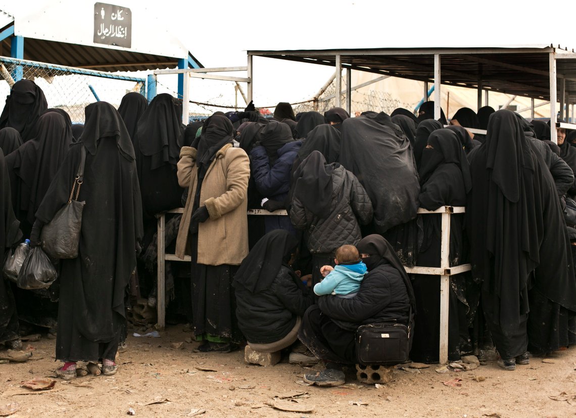 FILE - In this March 31, 2019 file, photo, women residents from former Islamic State-held areas in Syria line up for aid supplies at Al-Hol camp in Hassakeh province, Syria. Killings have surged inside the camp with at least 20 men and women killed in January, 2021. They are believed to be the victims of IS militants trying to enforce their power inside the camp housing 62,000 people, mostly women and children. (AP Photo/Maya Alleruzzo, File) FILE - In this March 31, 2019 file, photo, women residents from former Islamic State-held areas in Syria line up for aid supplies at Al-Hol camp in Hassakeh province, Syria. Killings have surged inside the camp with at least 20 men and women killed in January, 2021. They are believed to be the victims of IS militants trying to enforce their power inside the camp housing 62,000 people, mostly women and children. (AP Photo/Maya Alleruzzo, File)