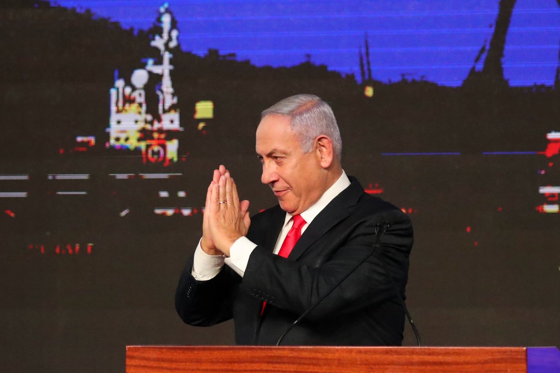 Israeli Prime Minister Benjamin Netanyahu greets his supporters after the first exit poll results for the Israeli parliamentary elections at his Likud party's headquarters in Jerusalem, Wednesday, March. 24, 2021. (AP Photo/Ariel Schalit) Israeli Prime Minister Benjamin Netanyahu greets his supporters after the first exit poll results for the Israeli parliamentary elections at his Likud party's headquarters in Jerusalem, Wednesday, March. 24, 2021. (AP Photo/Ariel Schalit)