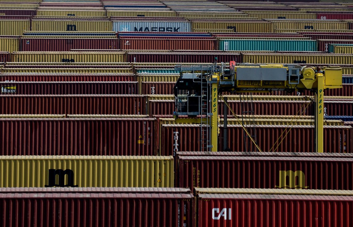 FILE - In this Monday, April 27, 2020 file photo, containers are moved in a container terminal in the Port of Antwerp. Judicial and law enforcement authorities in Belgium have dismantled an organized criminal network responsible for drugs trafficking involving corrupt police officers as they seized more than 2 million euros and some 3.5 tons of cocaine. (Johanna Geron, Pool Photo via AP, File) FILE - In this Monday, April 27, 2020 file photo, containers are moved in a container terminal in the Port of Antwerp. Judicial and law enforcement authorities in Belgium have dismantled an organized criminal network responsible for drugs trafficking involving corrupt police officers as they seized more than 2 million euros and some 3.5 tons of cocaine. (Johanna Geron, Pool Photo via AP, File)