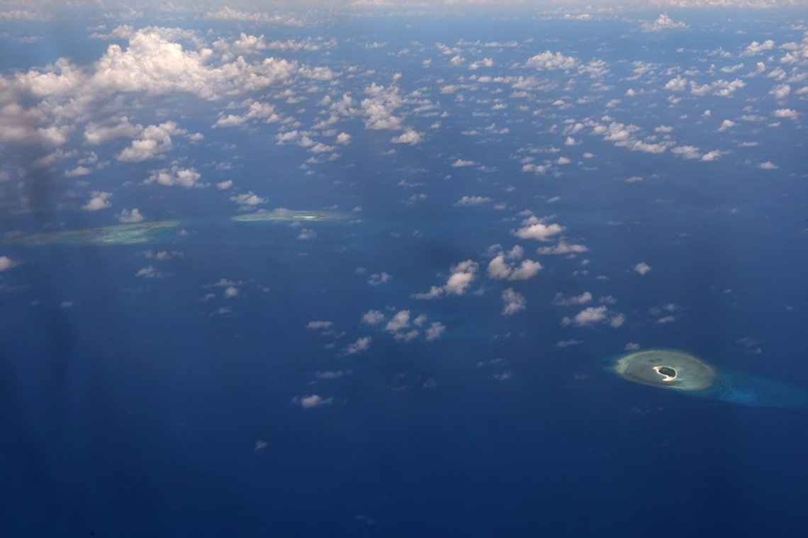 This picture taken on April 21, 2017 shows an aerial view of reefs in the disputed Spratly islands.
Philippine Defence Secretary Delfin Lorenzana flew to a disputed South China Sea island on April 21, brushing off a challenge by the Chinese military while asserting Manila's territorial claim to the strategic region. / AFP PHOTO / Ted ALJIBE (Photo credit should read TED ALJIBE/AFP via Getty Images) This picture taken on April 21, 2017 shows an aerial view of reefs in the disputed Spratly islands.
Philippine Defence Secretary Delfin Lorenzana flew to a disputed South China Sea island on April 21, brushing off a challenge by the Chinese military while asserting Manila's territorial claim to the strategic region. / AFP PHOTO / Ted ALJIBE (Photo credit should read TED ALJIBE/AFP via Getty Images)