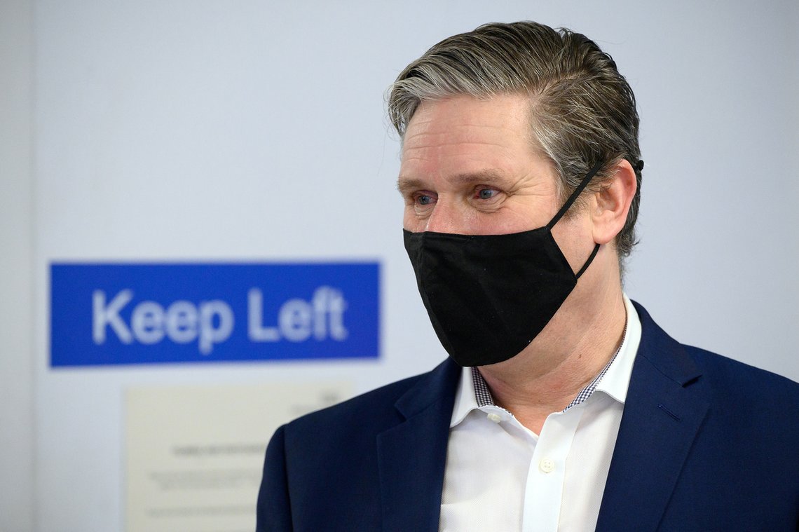 FILE PHOTO: Labour Party leader Keir Starmer speaks with medical staff during a visit to the Whittington Hospital in London, Britain, March 15, 2021. Leon Neal/Pool via REUTERS/File Photo FILE PHOTO: Labour Party leader Keir Starmer speaks with medical staff during a visit to the Whittington Hospital in London, Britain, March 15, 2021. Leon Neal/Pool via REUTERS/File Photo