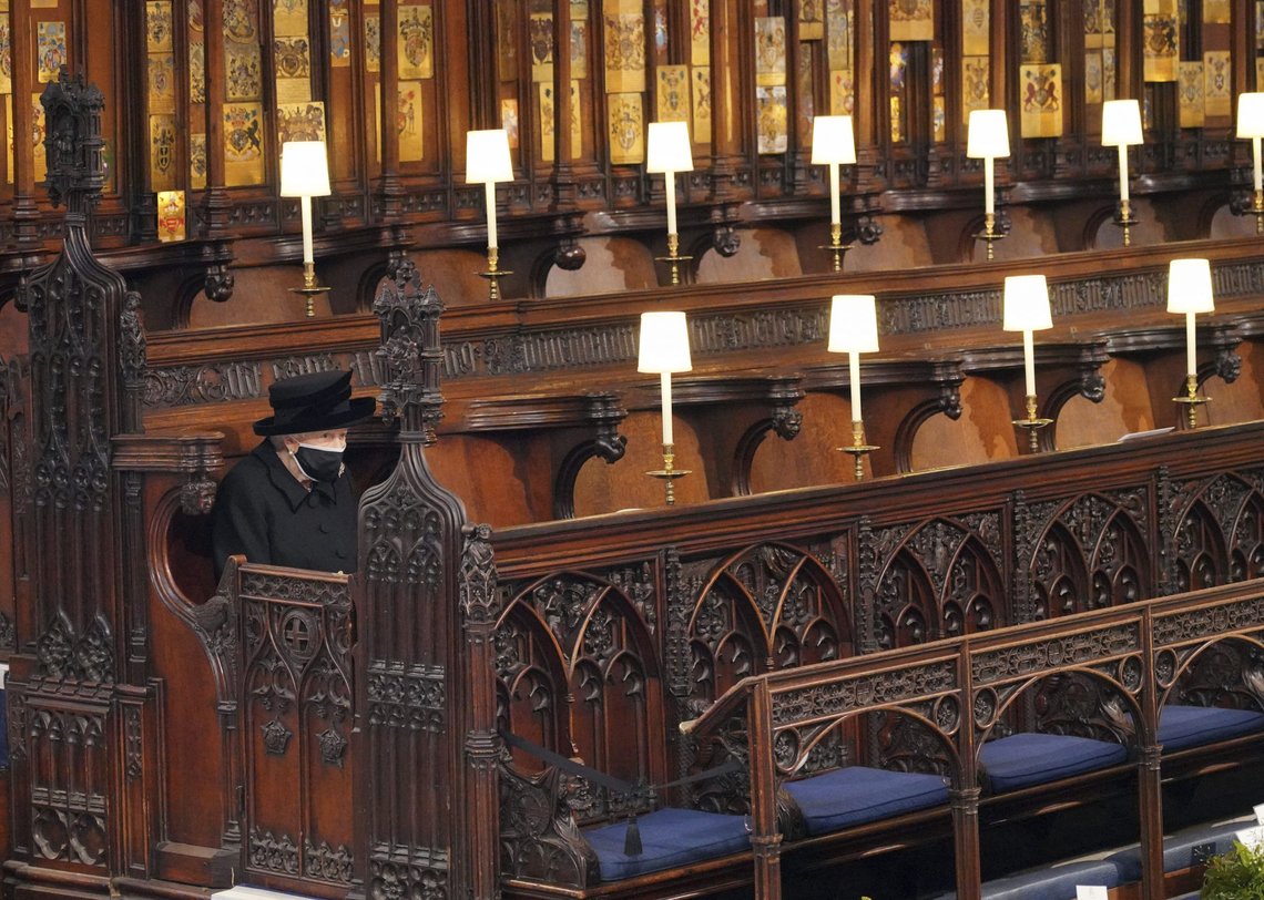 Britain's Queen Elizabeth II sits alone in St. Georges Chapel during the funeral of Prince Philip, the man who had been by her side for 73 years, at Windsor Castle, Windsor, England, Saturday April 17, 2021. Prince Philip died April 9 at the age of 99 after 73 years of marriage to Britain's Queen Elizabeth II. (Jonathan Brady/Pool via AP) Britain's Queen Elizabeth II sits alone in St. Georges Chapel during the funeral of Prince Philip, the man who had been by her side for 73 years, at Windsor Castle, Windsor, England, Saturday April 17, 2021. Prince Philip died April 9 at the age of 99 after 73 years of marriage to Britain's Queen Elizabeth II. (Jonathan Brady/Pool via AP)